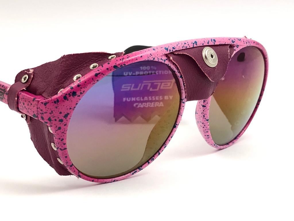 New 1980's Sunjet by Carrera Collection aviator pink spotted details frame with mirror lenses.   

Amazing craftsmanship and quality.   


New, never worn. Made in Austria.

Front : 14 cms

Lens Height : 5 cms

Lens Width : 5.4 cms