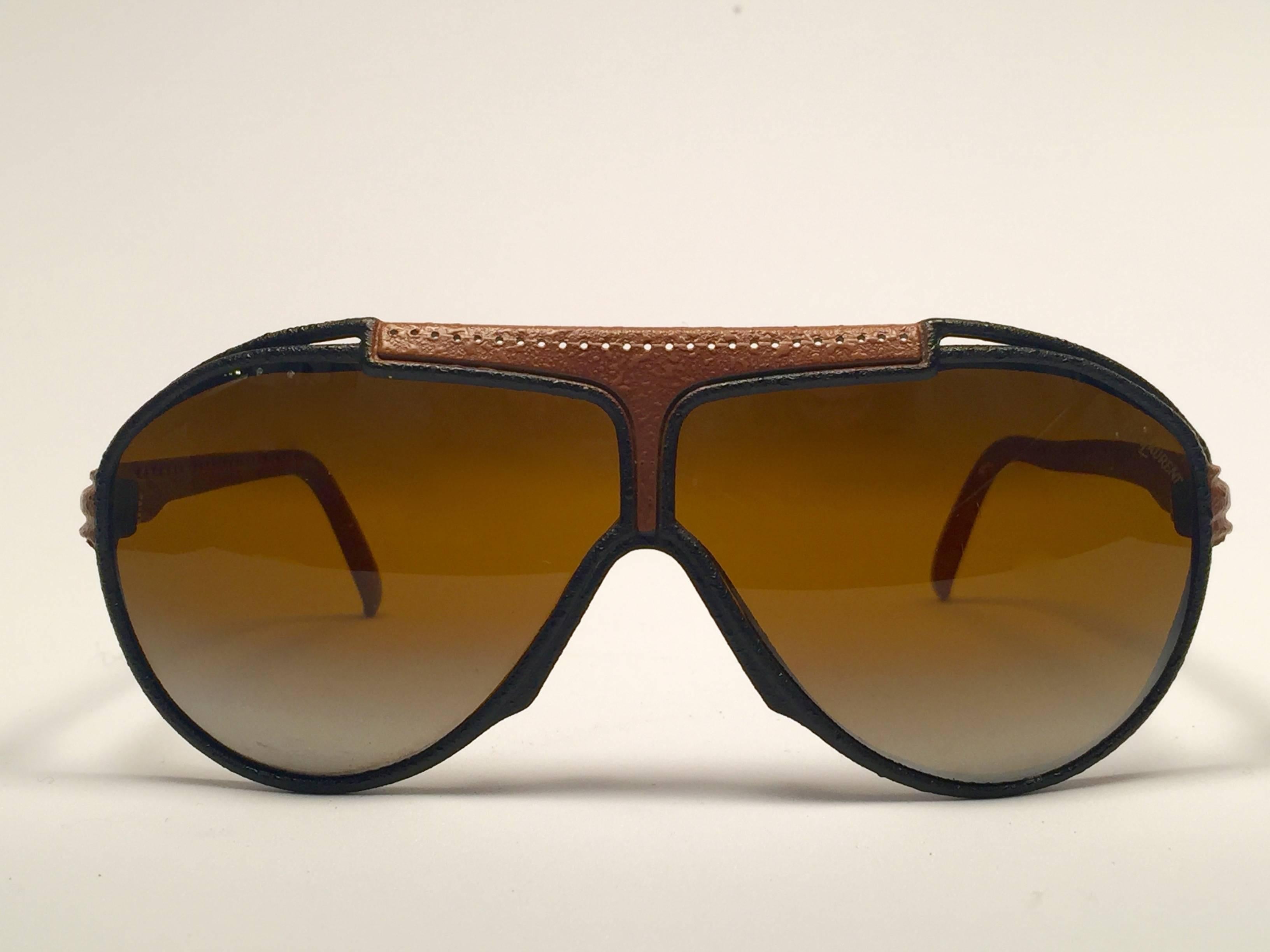 
Beautiful and stylish YSL sunglasses. Man made leather frame holding a pair of double gradient lenses with beautiful old Cassandre logo.

Comes with its original YSL sleeve.  This pair could show minor sign of wear due to storage. 
A great
