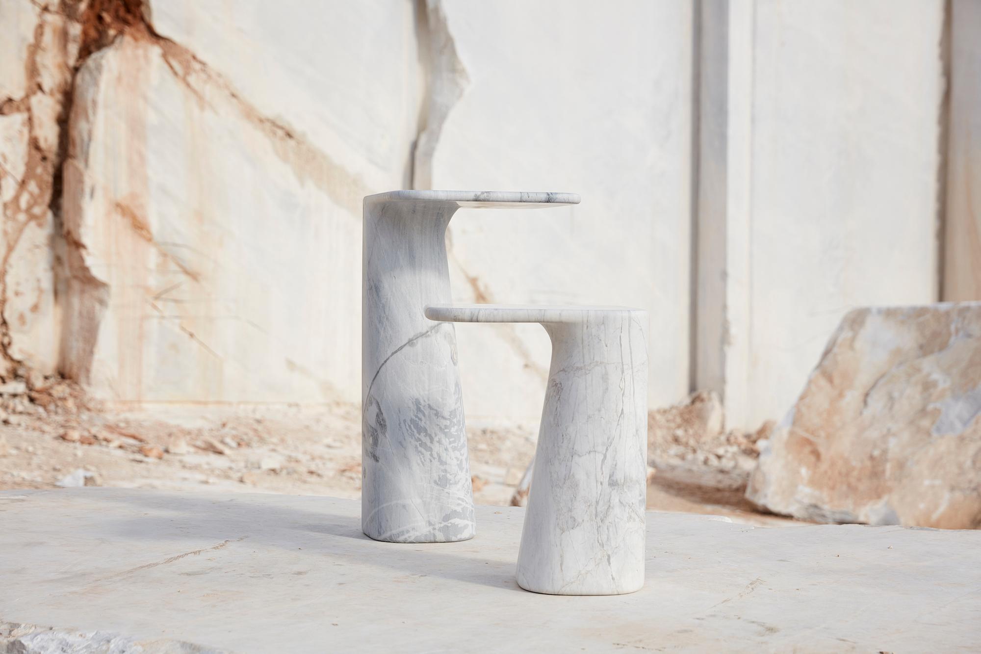 A solid piece of Elba is carved to create a cantilevered resting surface for objects. This is stone at its purest: simple, distinctive and statuesque. Cut to heights of 500mm or 720mm, each side table is available individually or as a complementary