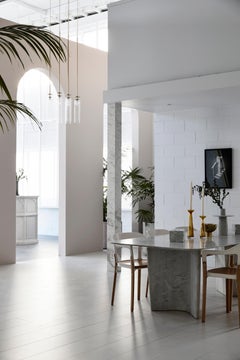 New Volumes marble Wyrie dining table by Nick Rennie