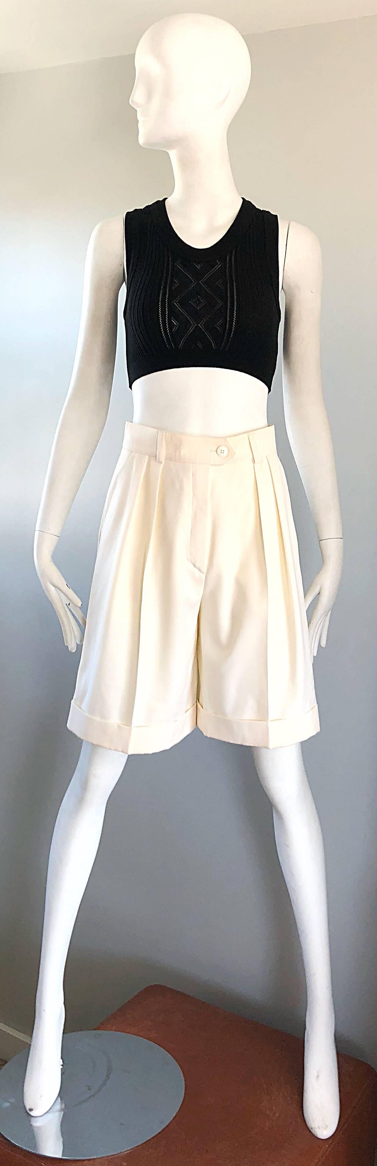 Chic late 1980s ESCADA by MARGARETHA LEY new with original store tags ivory / off-white wide leg culottes shorts! Flattering pleated front with pockets at each side of the waist. Button closure at front center with a zipper fly. Super soft