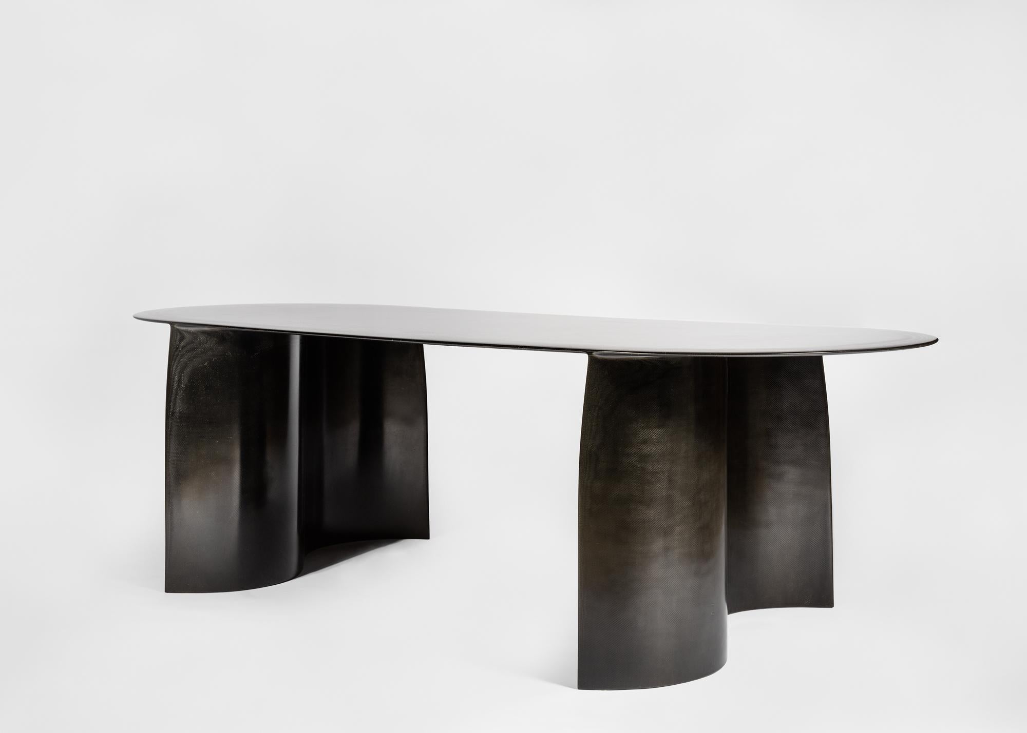 The New Wave Dining Table by STUDIO LUKAS COBER. The New Wave collection illustrates his fascination for oceans force. They are built by hand-layering numerous layers of fiberglass cloth with resin into desired shapes. After combining the shapes and