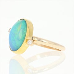 Welo Opal and Diamond Ring, 14 Karat and 22 Karat Yellow Gold Bypass