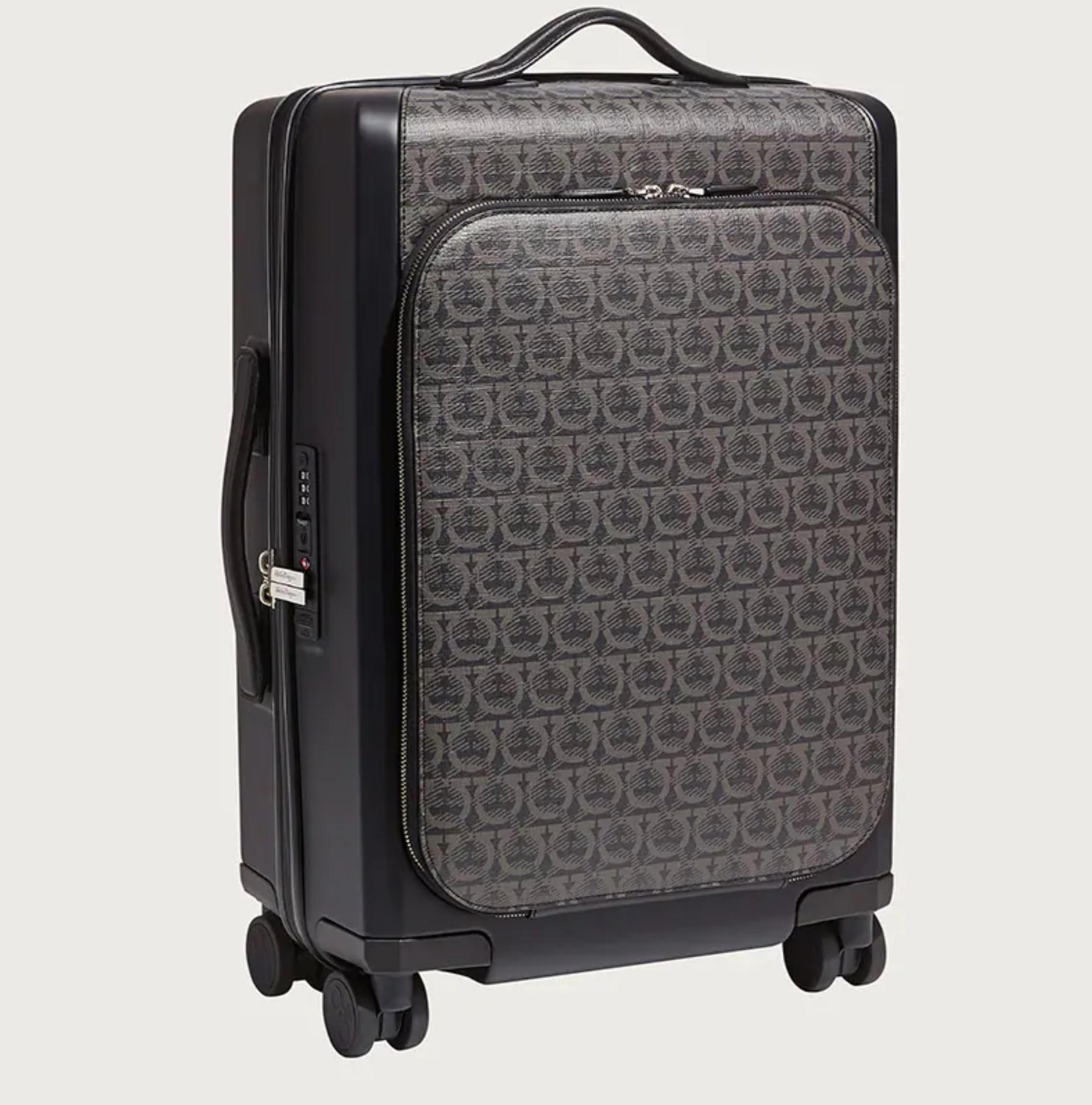 Salvatore Ferragamo
Brand New With Tags
$1990
Charcoal and black leather and acetate Salvatore Ferragamo small Gancini trolley with silver-tone hardware
Zip pocket at front
Flat handles
Retractable handle drop
Four wheels at base
Black canvas
