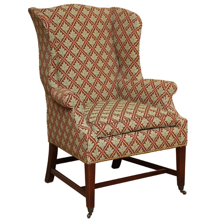 NEW Wood & Hogan Wing chair with thin lines and graceful contours.  Luxurious comfort with 80-20 goose down seat cushion. Mahogany square tapered legs and stretcher.  Front legs terminate with solid brass shoe & caster.   

Extremely comfortable and