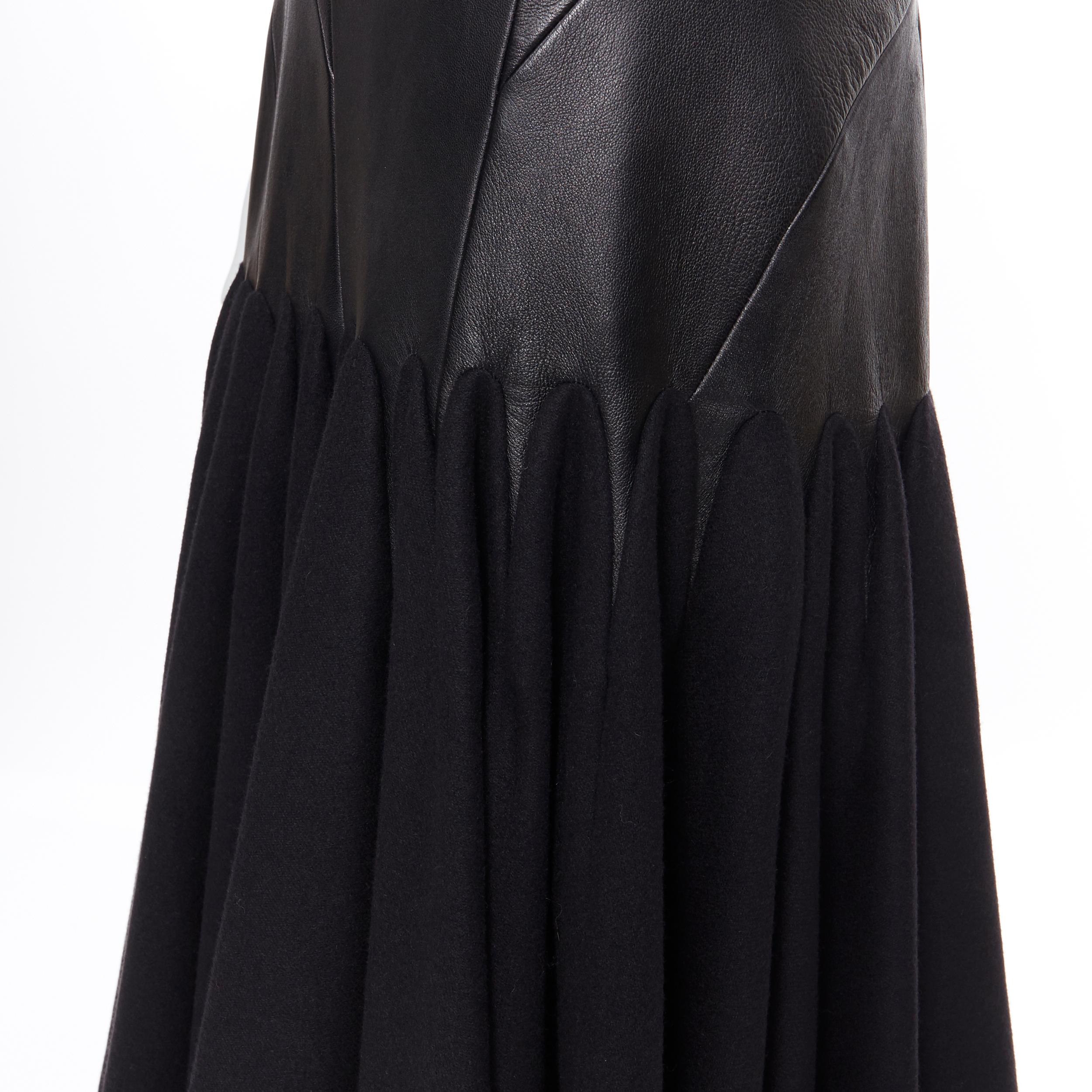 new YOHJI YAMAMOTO AW18 Runway black leather waist pleated hem skirt JP2 Reference: TGAS/A04827 
Brand: Yohji Yamamoto 
Designer: Yohji Yamamoto 
Collection: Fall Winter 2018 Runway 
Material: Wool 
Color: Black 
Pattern: Solid 
Closure: Zip