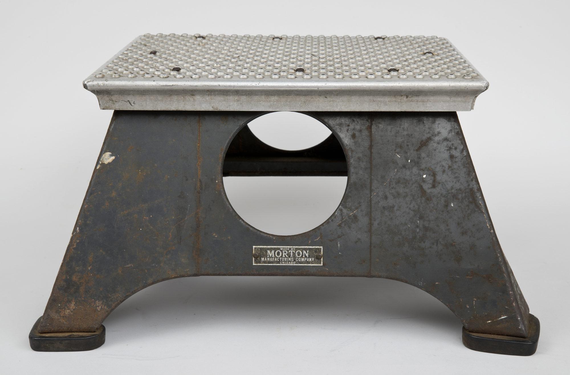 1940s steel step stool used by the New York Central System train line. Label: Made by Morton Manufacturing Co. Chicago.