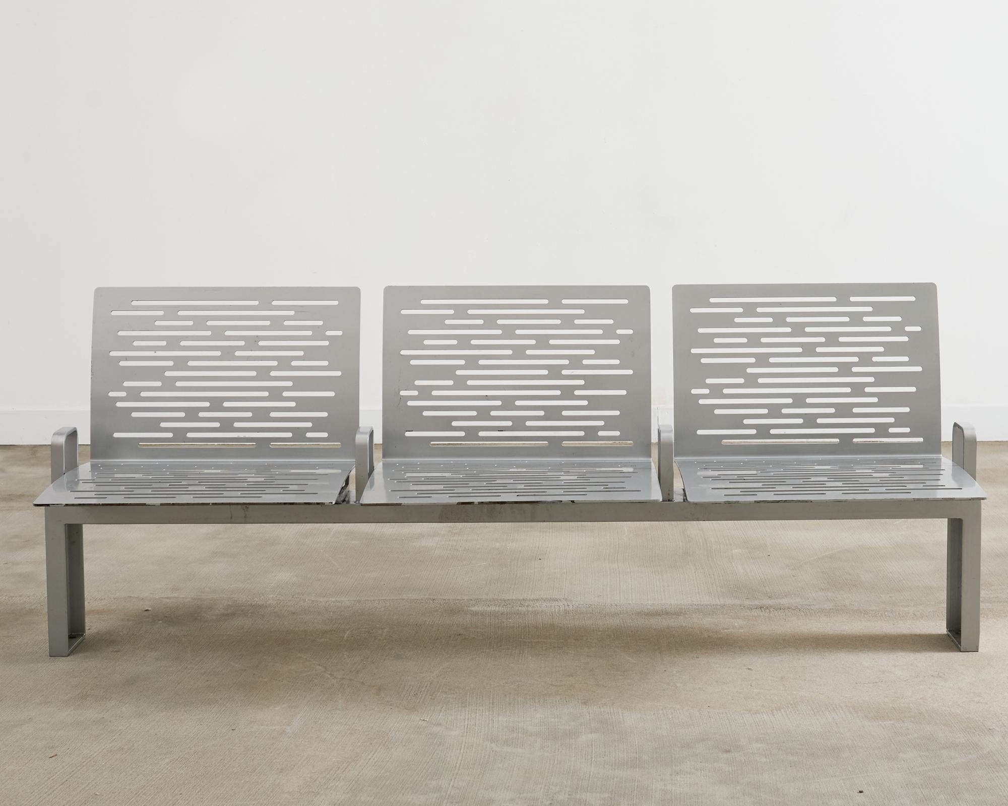 Iconic New York City post modern park bench designed by Ignacio Ciocchini for the city of New York. Crafted from powder coated iron designed to dissipate heat in the summer and shed snow in the winter. The bench is very heavy and solid with