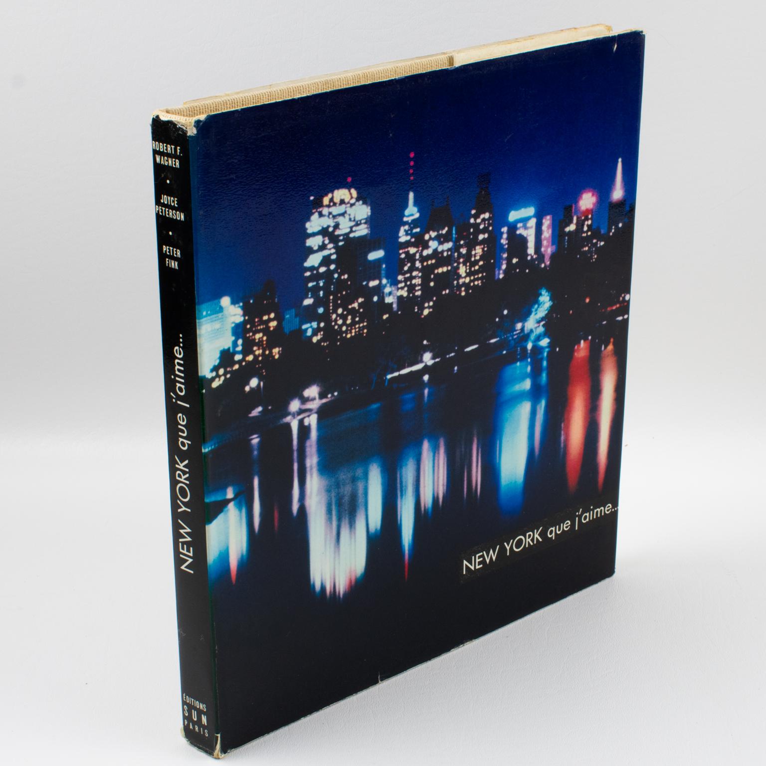 New York Que J'aime (New York I love), a French book by Robert F. Wagner (New York Mayor). Text by Joyce Peterson, and Photographs by Peter Fink.
New York is undoubtedly the most dynamic and exciting metropolis but also the most elusive. It is a