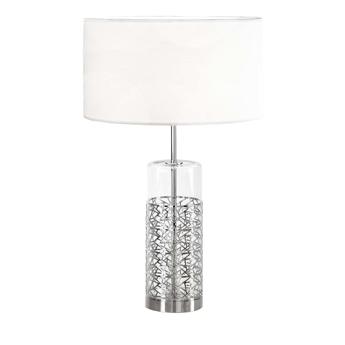 The refinement of this splendid table lamp lies in the captivating combination of solids and voids. Its frame is in chrome-plated metal and comprises a circular base from which rises a central stem. The stem is surrounded by a cylindrical element