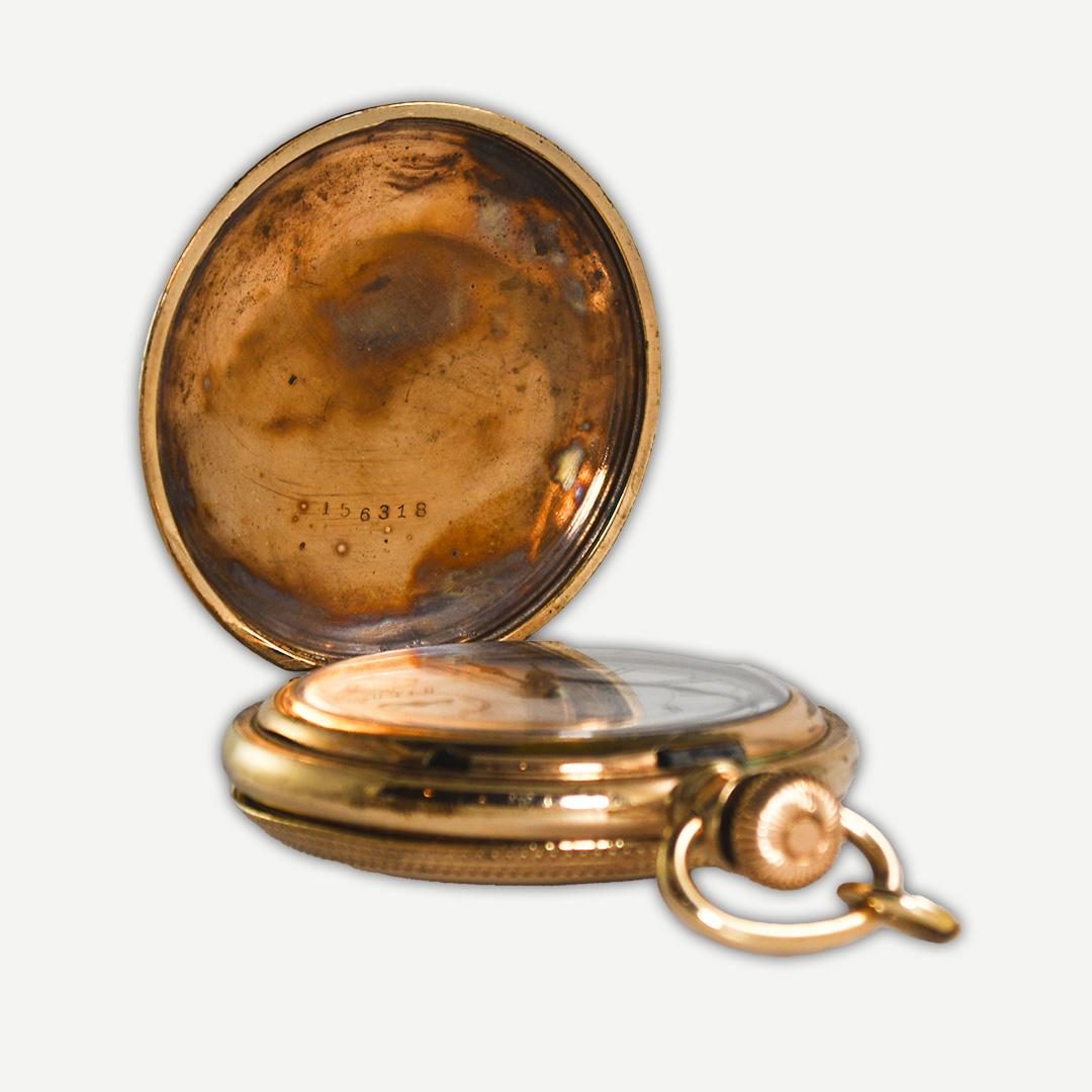 New York Standard Watch Co.
The pocket watch has a 14k gold-filled case.
Size 6, No. 44 hunting case.
The serial number is 2201875.
The company sold watches from 1888 to 1929.
7 jewel movement is lever time set, 3/4 plate, runs well. 
The crystal