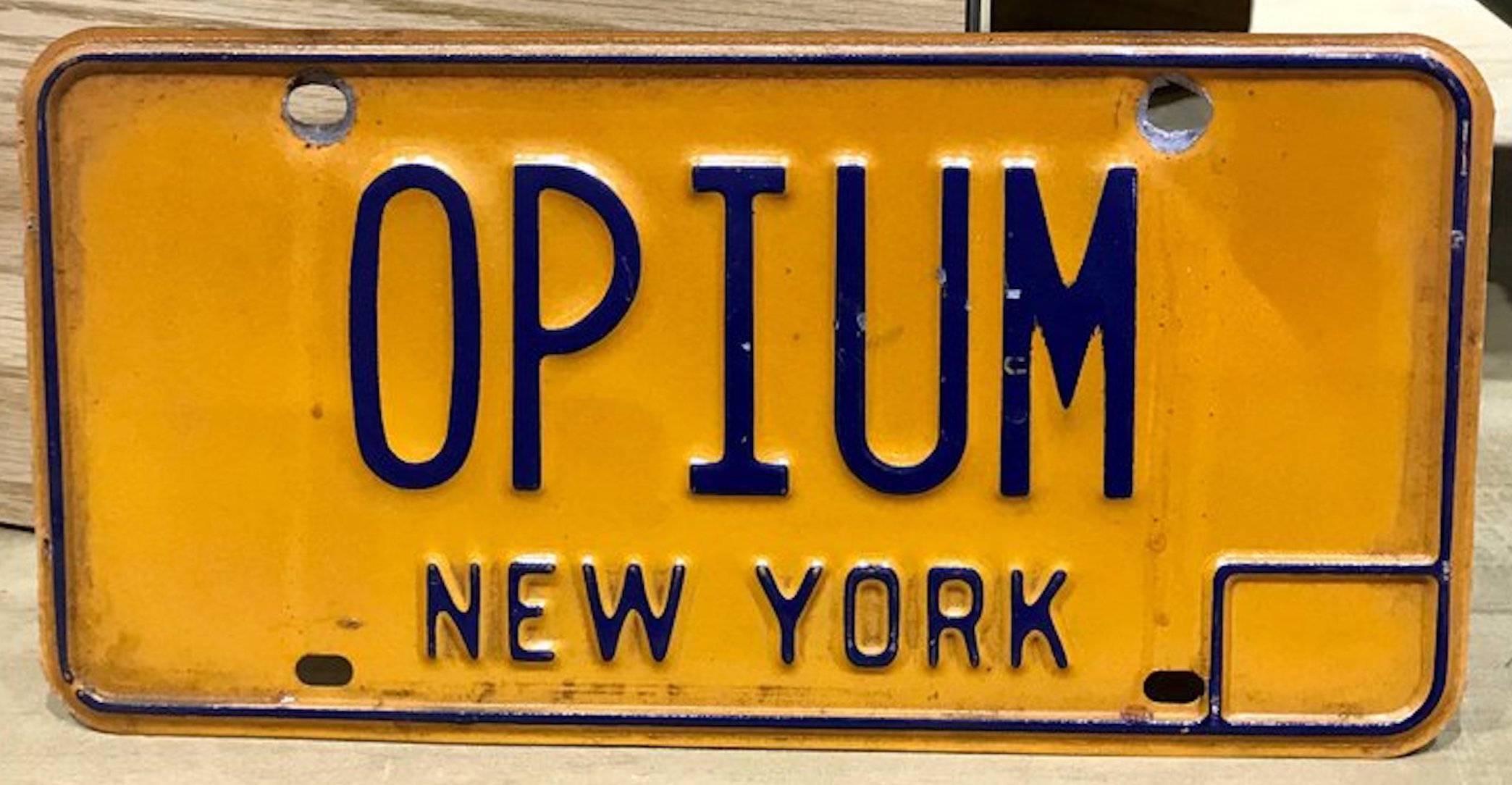 New York vanity license plate OPIUM, authentic vintage license plate.

If you love a touch of antiquity, check out this New York Vanity License Plate OPIUM. Owned and used on a vehicle from the late 20th century, it screams the charm and flavor of