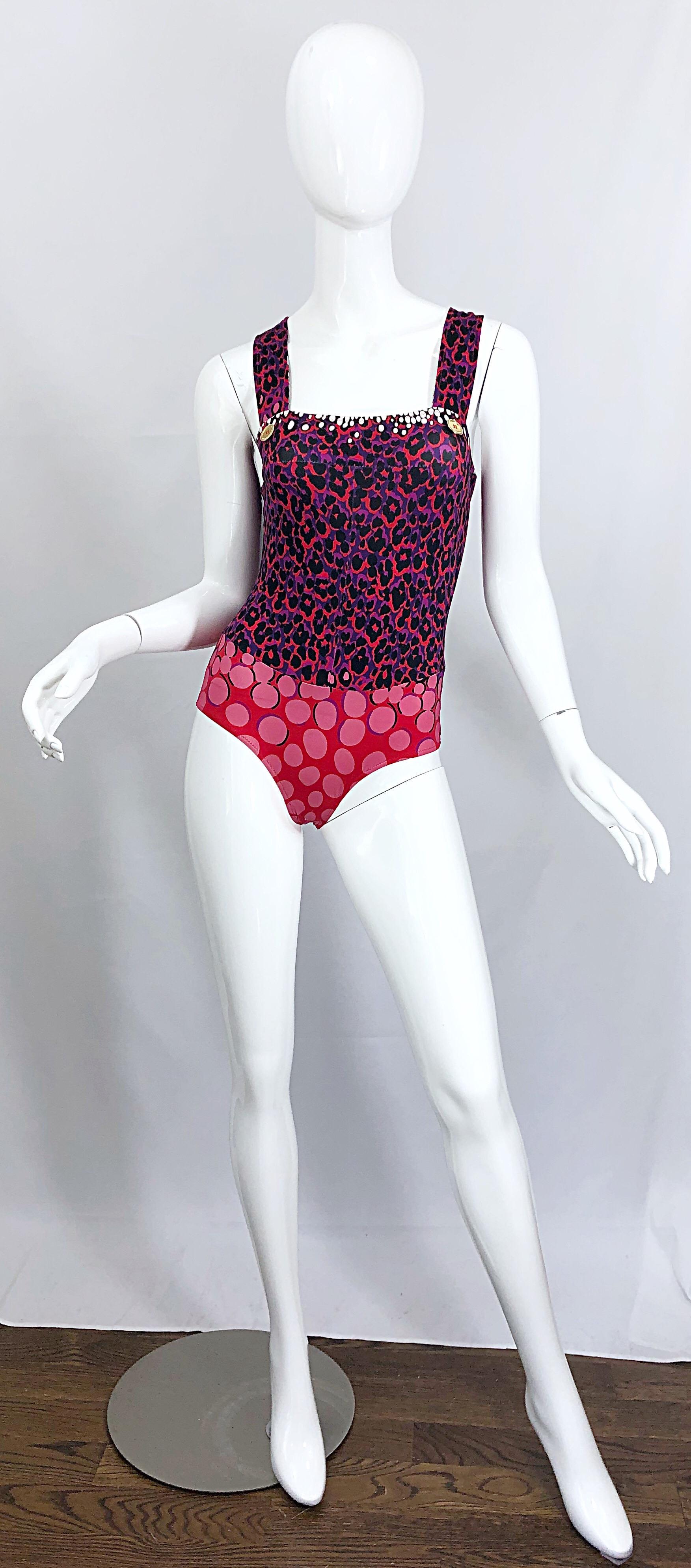 Sexy new YVES SAINT LAURENT purple and red leopard print and polka dot one piece swimsuit or bodysuit! Features a leopard print on the bodice and abstract polka dots on the bottom. Two gold buttons at each strap. Great for the beach, pool, yacht.