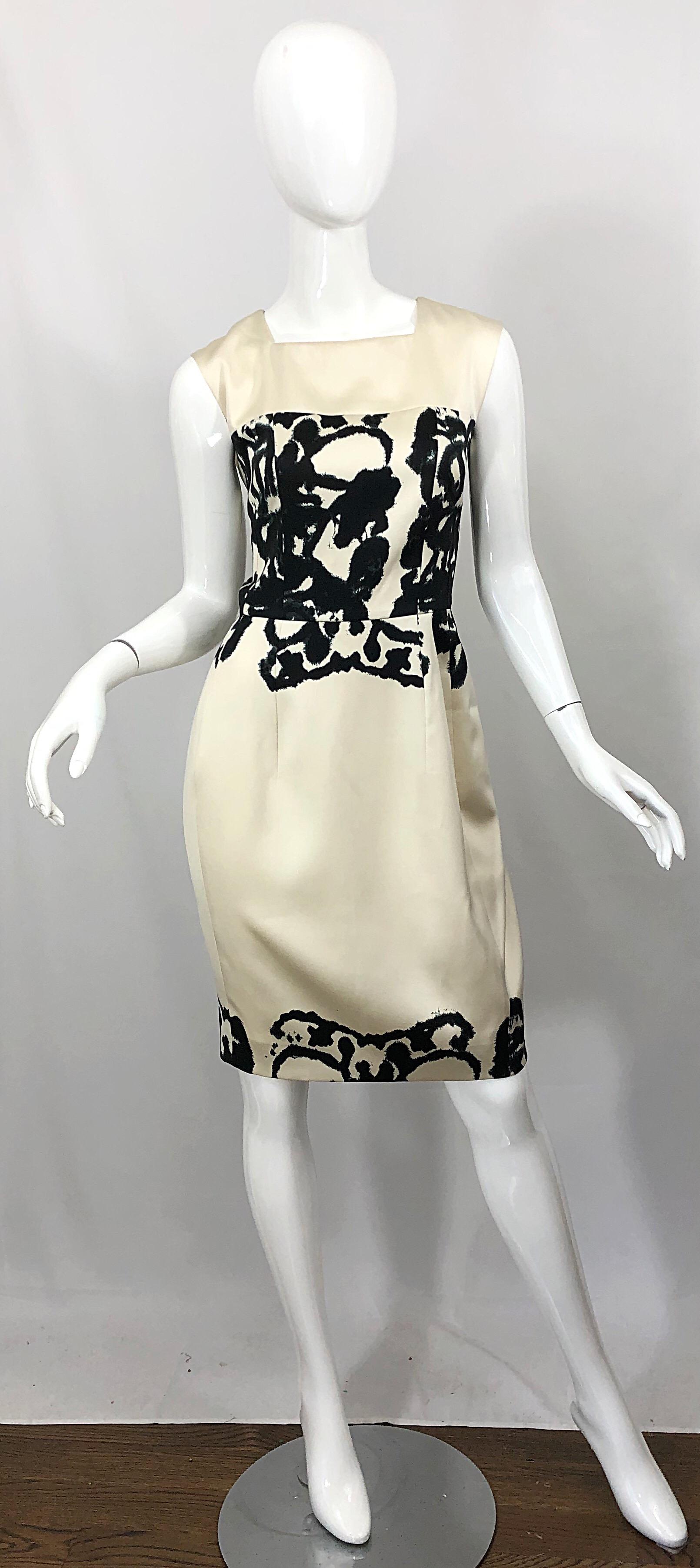 Chic brand new YVES SAINT LAURENT ( YSL ) ivory and black abstract print sleeveless silk dress! Sleek tailored bodice with a square neckline. Abstract black print on the front and back bodice and at bottom hem. Hidden zipper up the back with