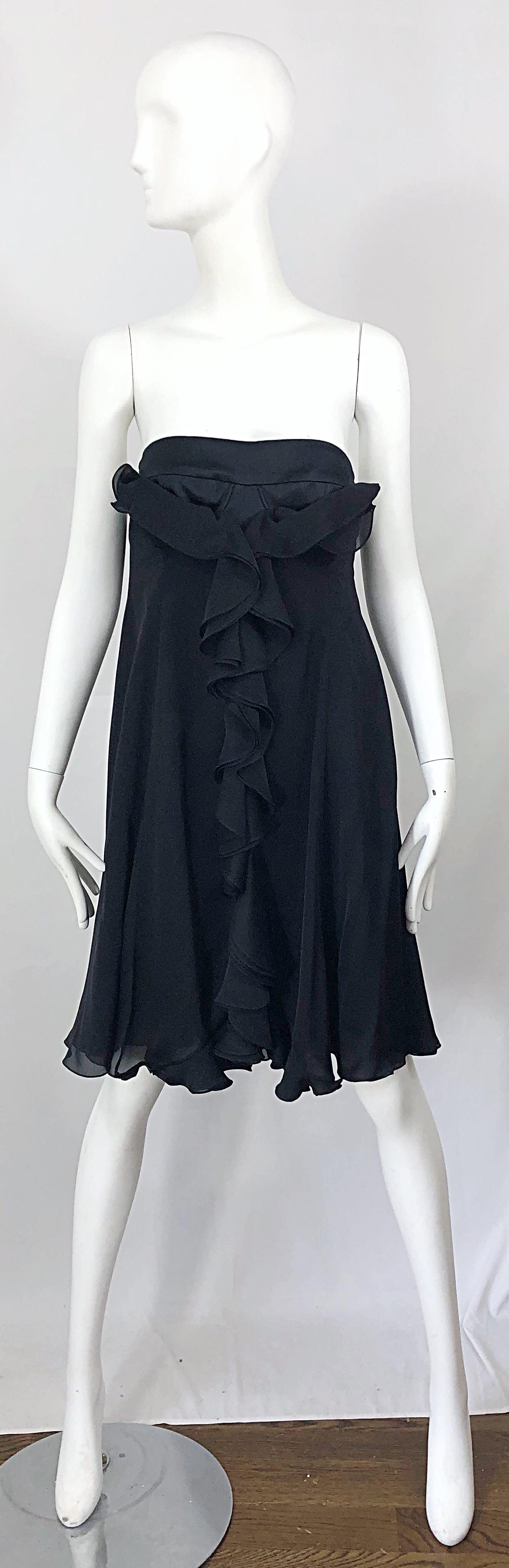 Chic brand new with tags YVES SAINT LAURENT Spring 2008 black silk strapless dress! Features intricate interior corset boning that holds everything in place. Hidden zipper up the side with hook-and-eye closure. Additional lace closures at back with