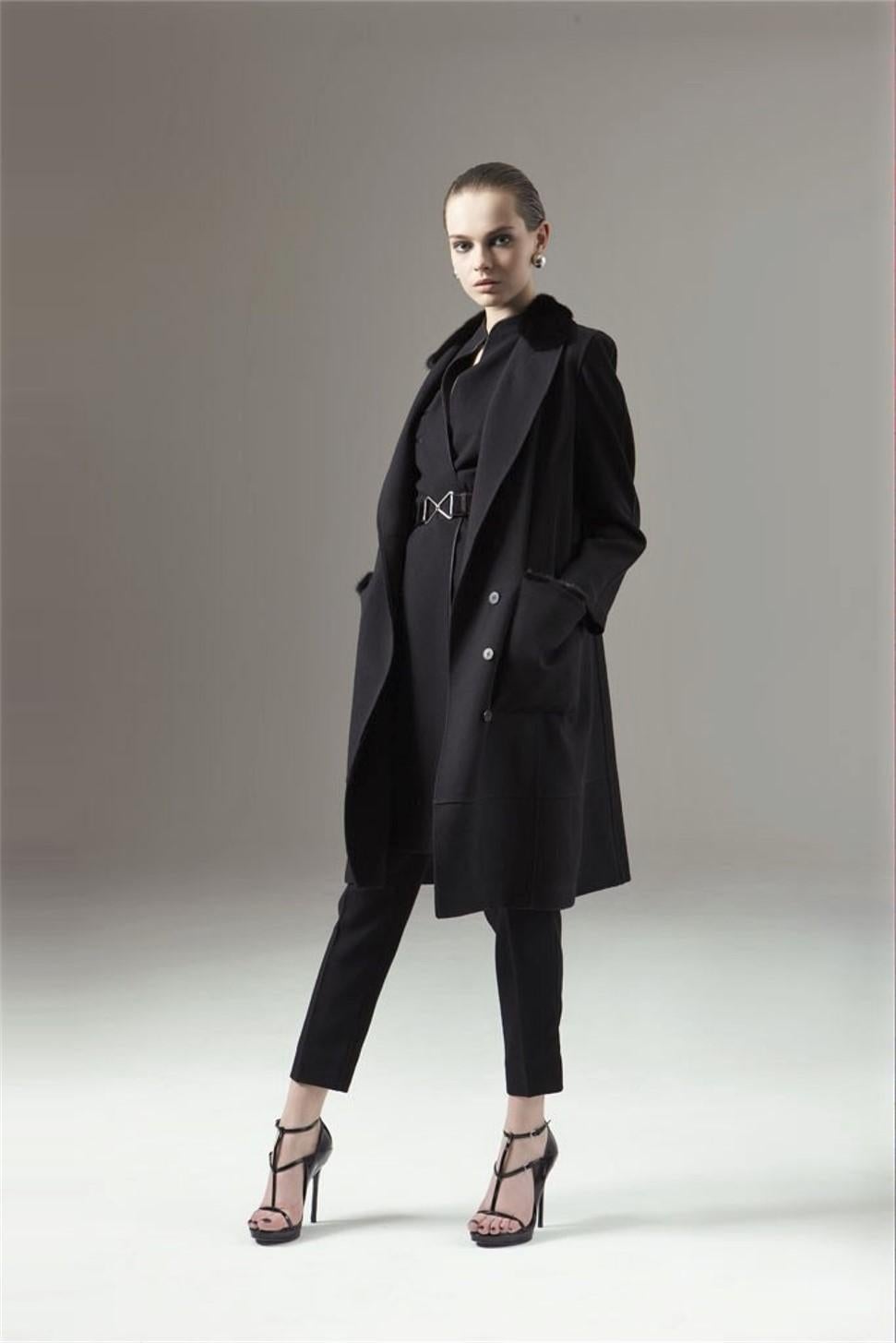 Yves Saint Laurent
Pre-Fall 2009
Brand New Without Tags
$4450
Black Wool Mid/Long Coat
FR40  
Mink Collar, Mink Trim on Pockets & Mink Trimmed Belted Tie
Two Front Large Pockets
Button and Sash Tie Closure

Bust: 45