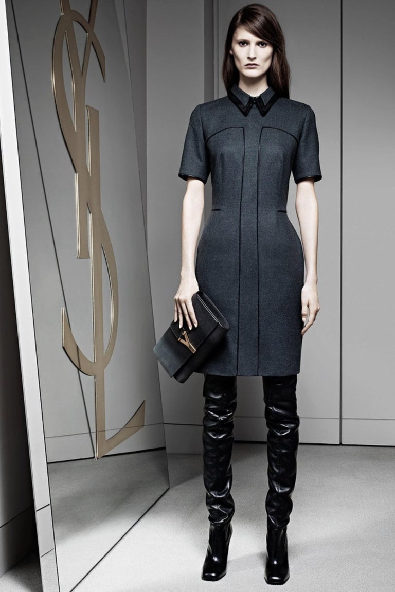 Stefano Pilati for Yves Saint Laurent 
Pre-Fall 2012
Brand New Without Tags
Charcoal Wool Dress
Lamb Leather Piping and Collar
Zips Up the Back

Italian Size 38

Bust: 36