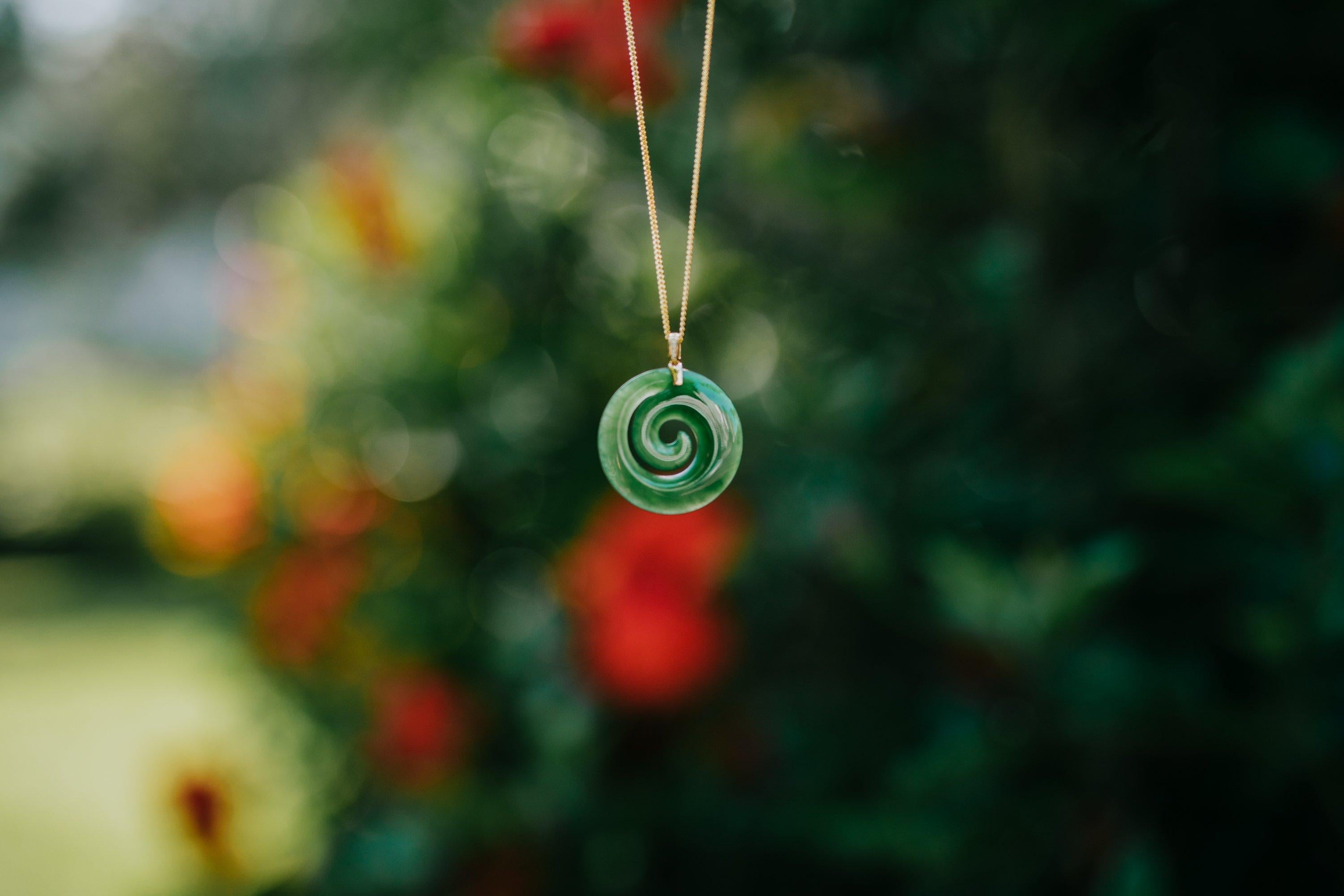 This is a unique handmade Jade Necklace in 18K Yellow Gold and this is from New Zealand and also this is known as a Pounamu  

Pounamu is considered a precious and powerful stone by Māori people. It is often carved into a pendant or necklace which