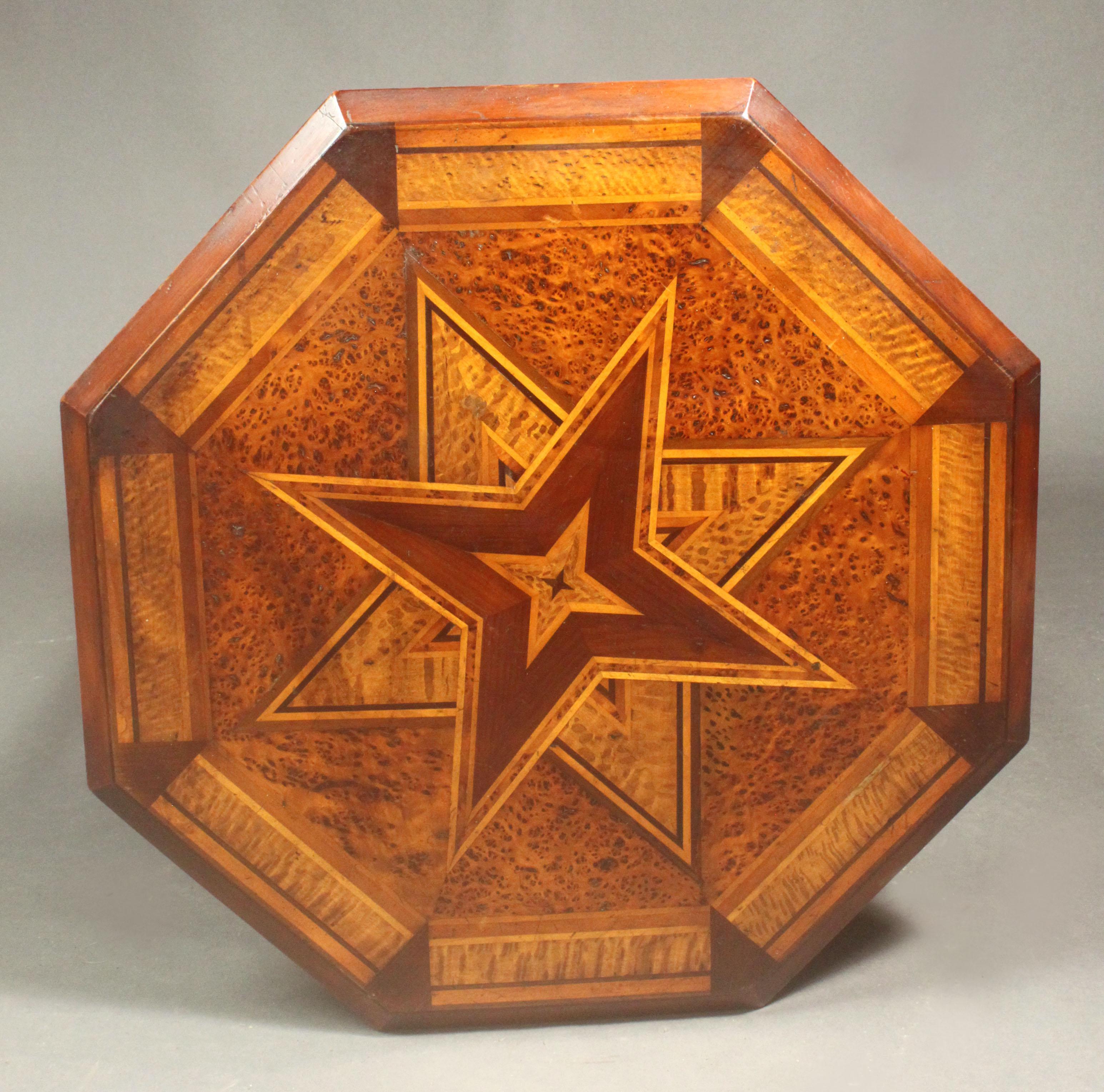 Late 19th century New Zealand native timber inlaid table in the manner of Anton Seuffert, the octagonal top with various show woods in the form of stars: the indigenous woods probably include kauri, mangeao, towai and rimu on a rewarewa ground; on