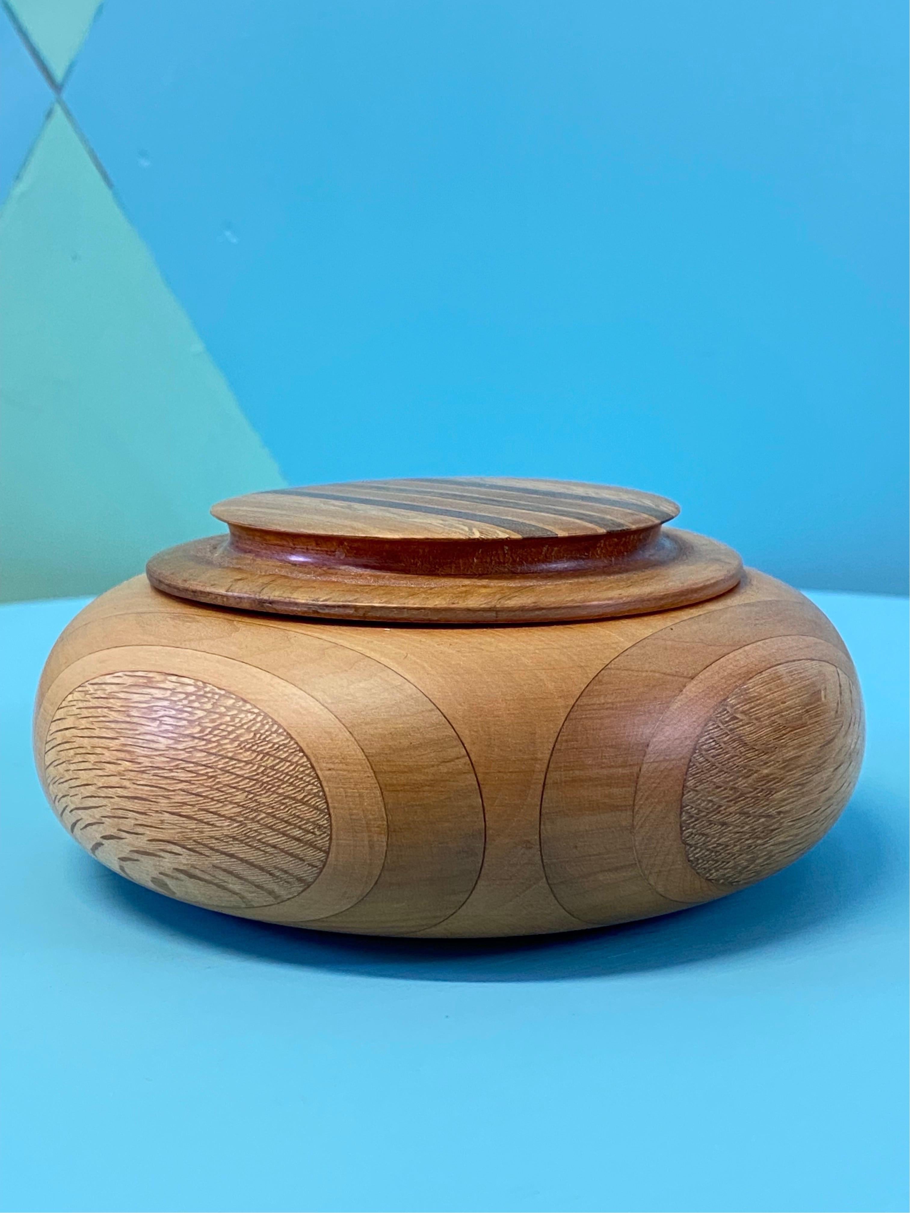 This delightful trinket box made of specimen New Zealand timbers was made in the mid 1950s. New Zealand at this time had a small but viable tourism industry, based on the country's exceptional natural attractions - majestic mountains, unique flora