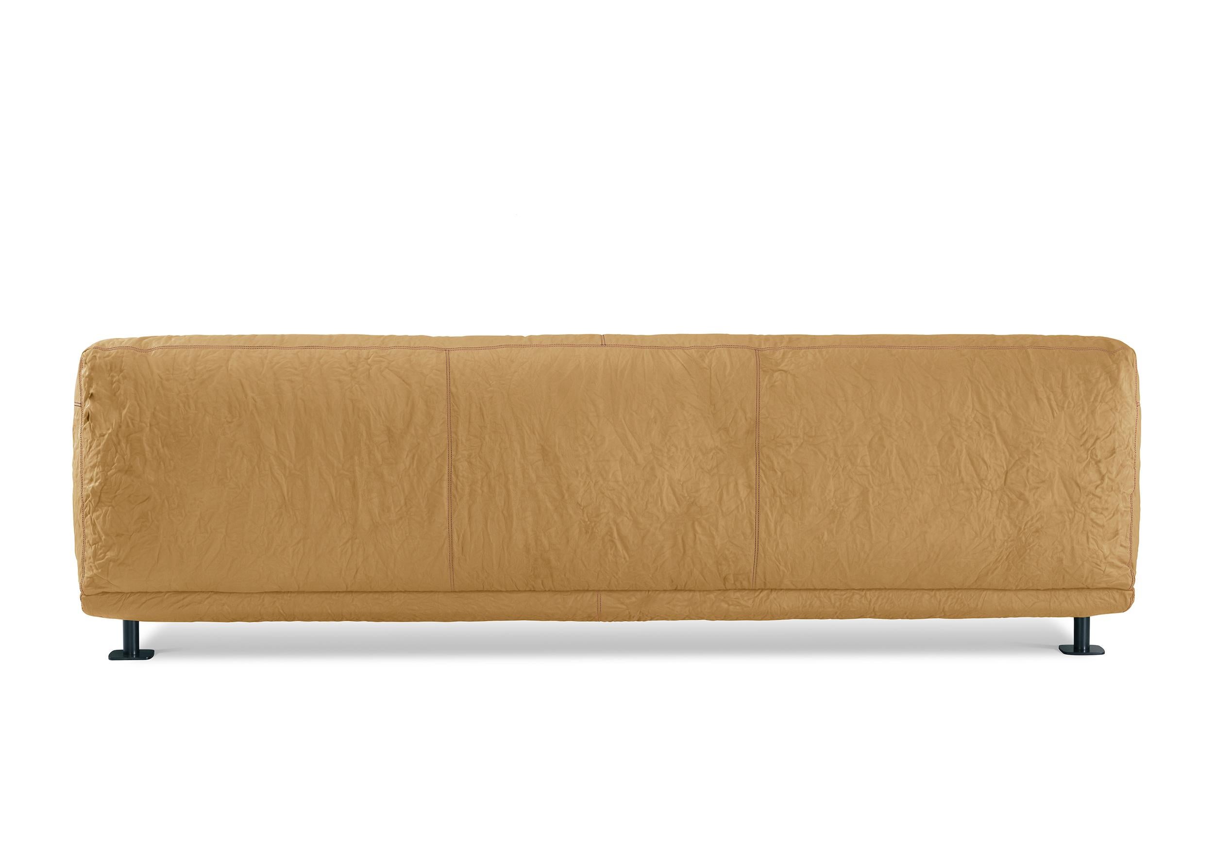Sofa-fortress, solid and welcoming, whose surface imitates the natural irregularities of stone. Structure in wood and metal, polyurethane padding with goose down topper.

Newcastle, designed by Giulio Iacchetti, is a welcoming fortress, with a solid