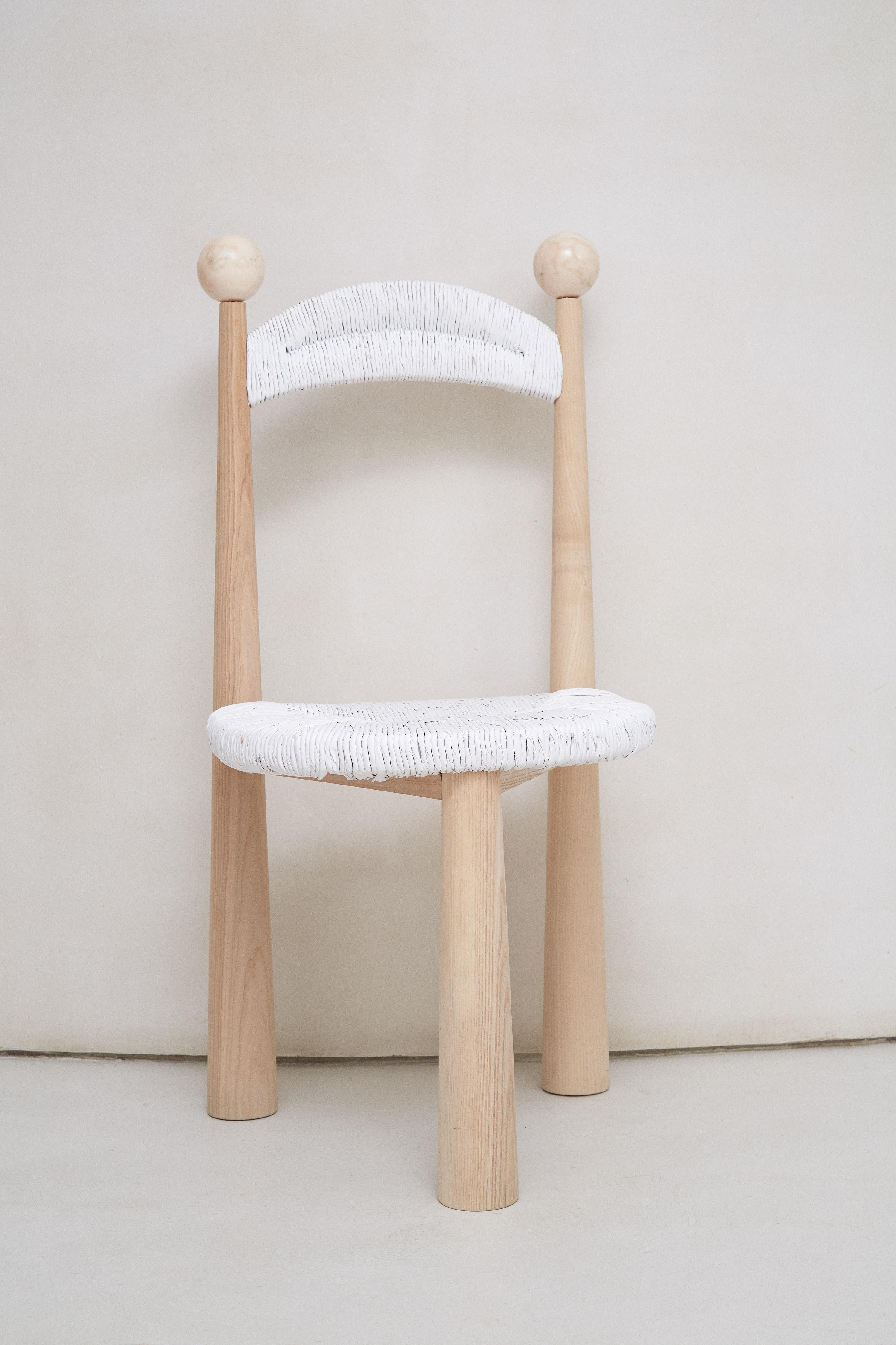 Newcastle Chair by Patricia Bustos de la Torre
Dimensions: D 47 x W 48 x H 91 cm.
Materials: Wood and plush.

Newcastle Chair is a three-legged wooden chair with a rattan seat capable of transforming any dining room. This perfect balance between