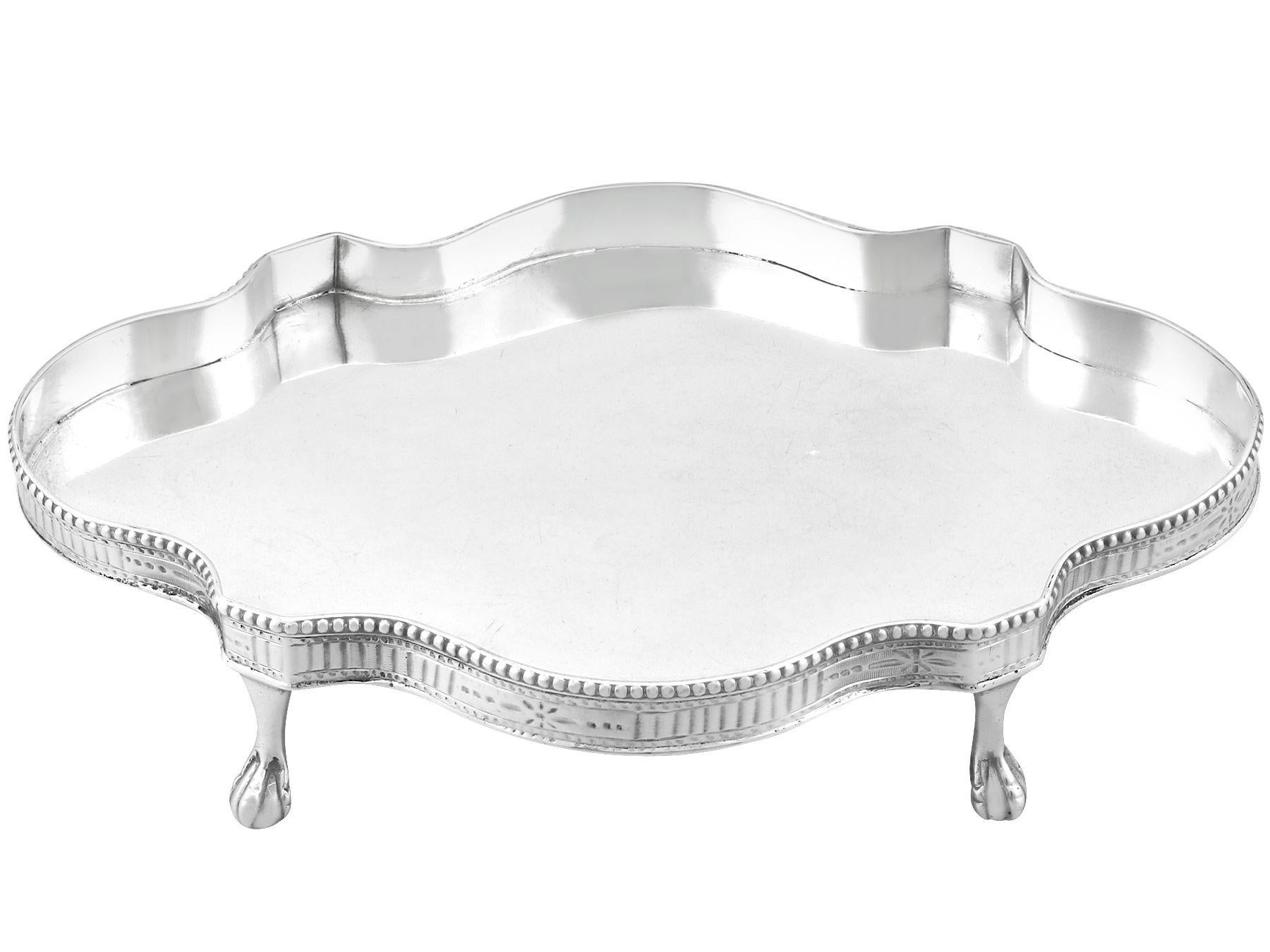 A fine and impressive antique Georgian Newcastle sterling silver teapot stand made by John Langlands I & John Robertson I; an addition to our ornamental silverware collection

This fine and impressive antique Georgian sterling silver teapot stand