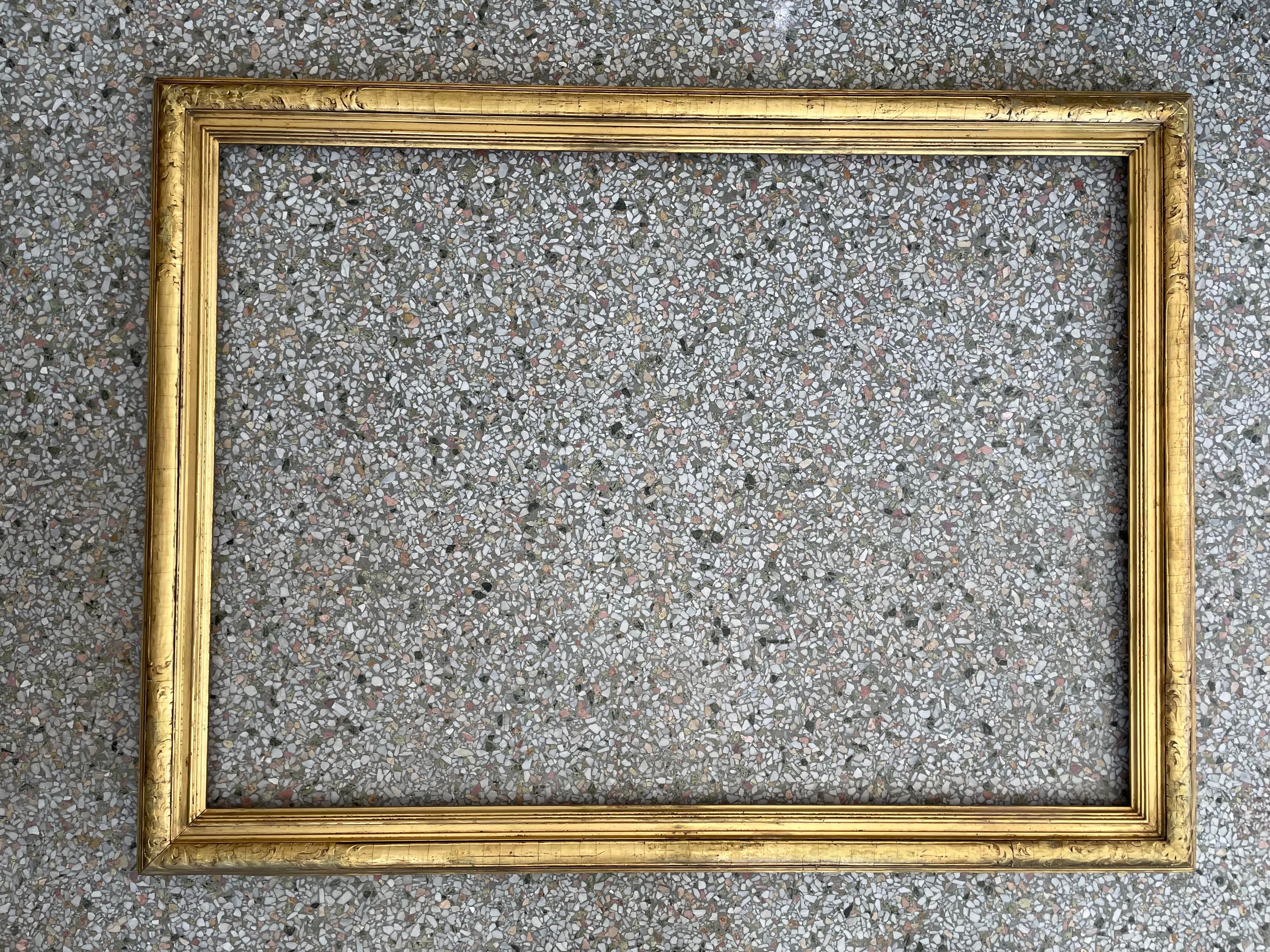 This stylish and chic Renaissance revival style frame dates to the 1920s-1930s and was created by the America firm Newcomb Macklin. 

Note: Overall dimensions are 40.50