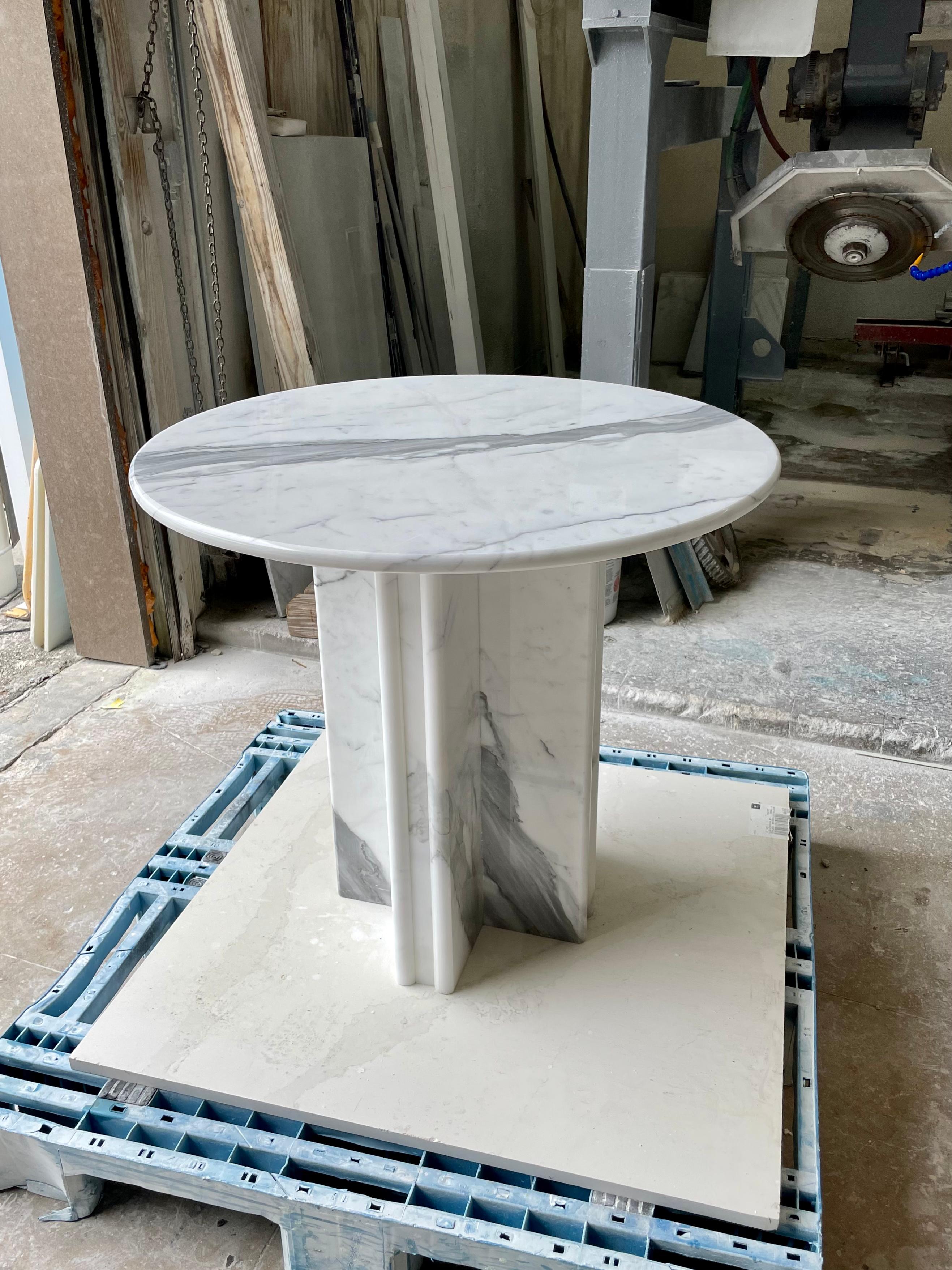 Built and ready to ship! Our custom Italian Carrara marble center / breakfast / game table of three centimeters thick Italian Carrara marble fabricated in an early 20th century Modernist architecture.

We hand fabricate and polish or hone each of