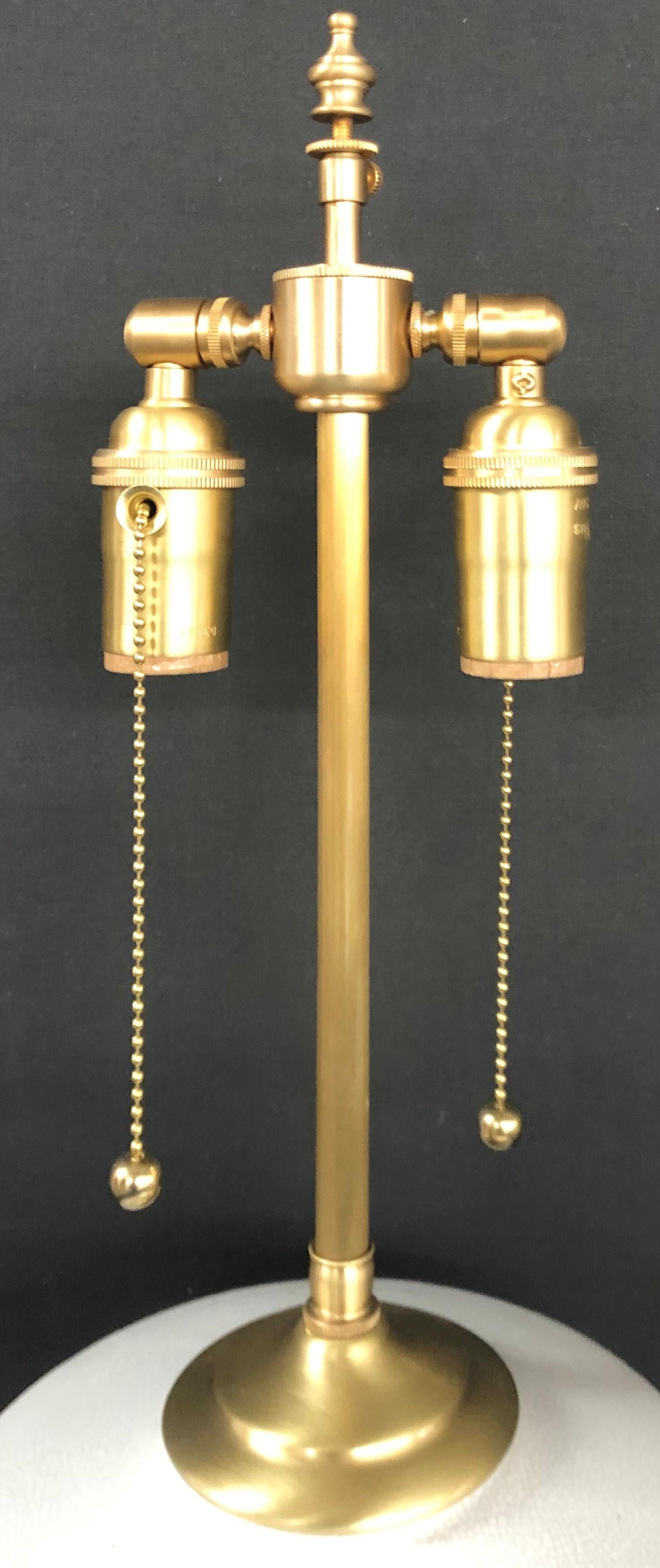 A unique pair of vessels we found that we envisioned to make great lamps. The hand painted, gold stripes add a level of simple elegance to the bases. The hardware is custom Brushed brass with dual controlled sockets for bulbs up to 100 watts each.