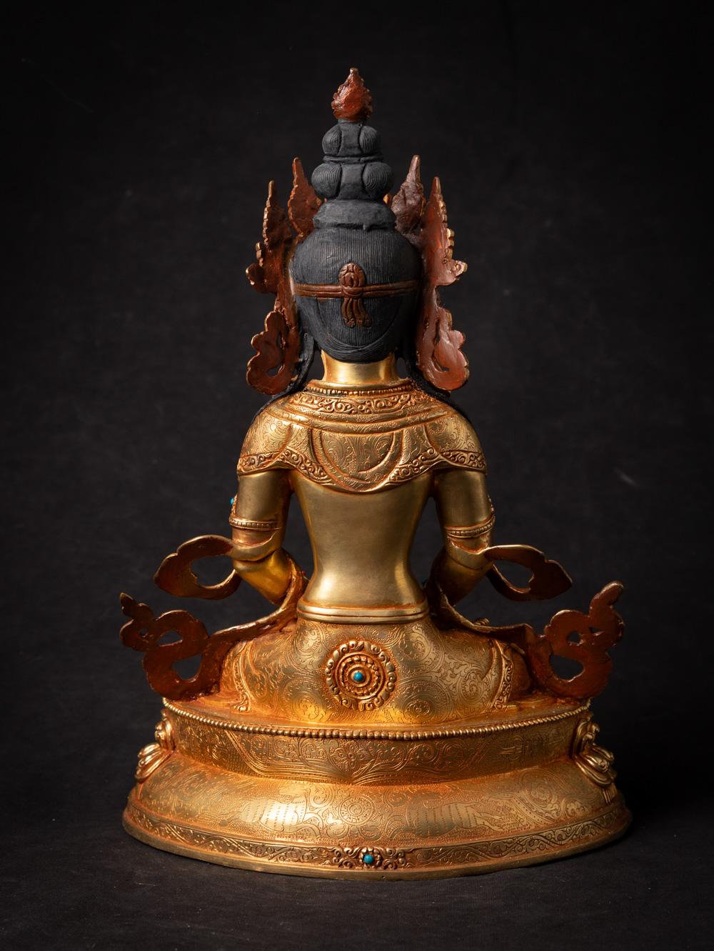 Material : bronze
32,6 cm high
23,6 cm wide and 16,2 cm deep
Fire gilded with 24 krt. gold - the face is gold painted
Dhyana mudra
Newly made in the highest quality !
Weight: 3,6 kgs
Originating from Nepal
Nr: 3713-8