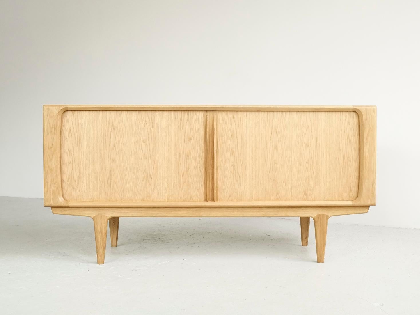 Sideboard model no. 142 was originally designed by Bernhard Pedersen in 1965 in Denmark. Today it is newly manufactured by the same company: Bernhard Pedersen & Søn in Denmark. It is a true piece of craftsmanship and it is made according to the
