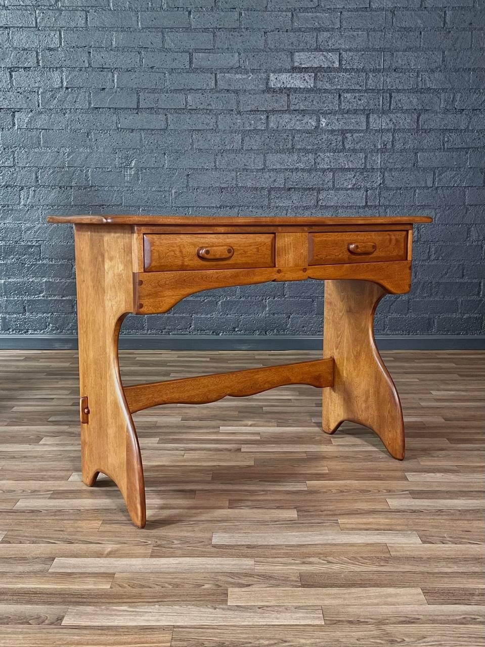 Condition: Expertly Refinished
Materials: Light-Walnut Stained Maple
Style: American Studio Craft 

This American Studio Craft desk or console table, crafted in the 1950s, embodies the organic modern ethos with its fluid lines and sculptural