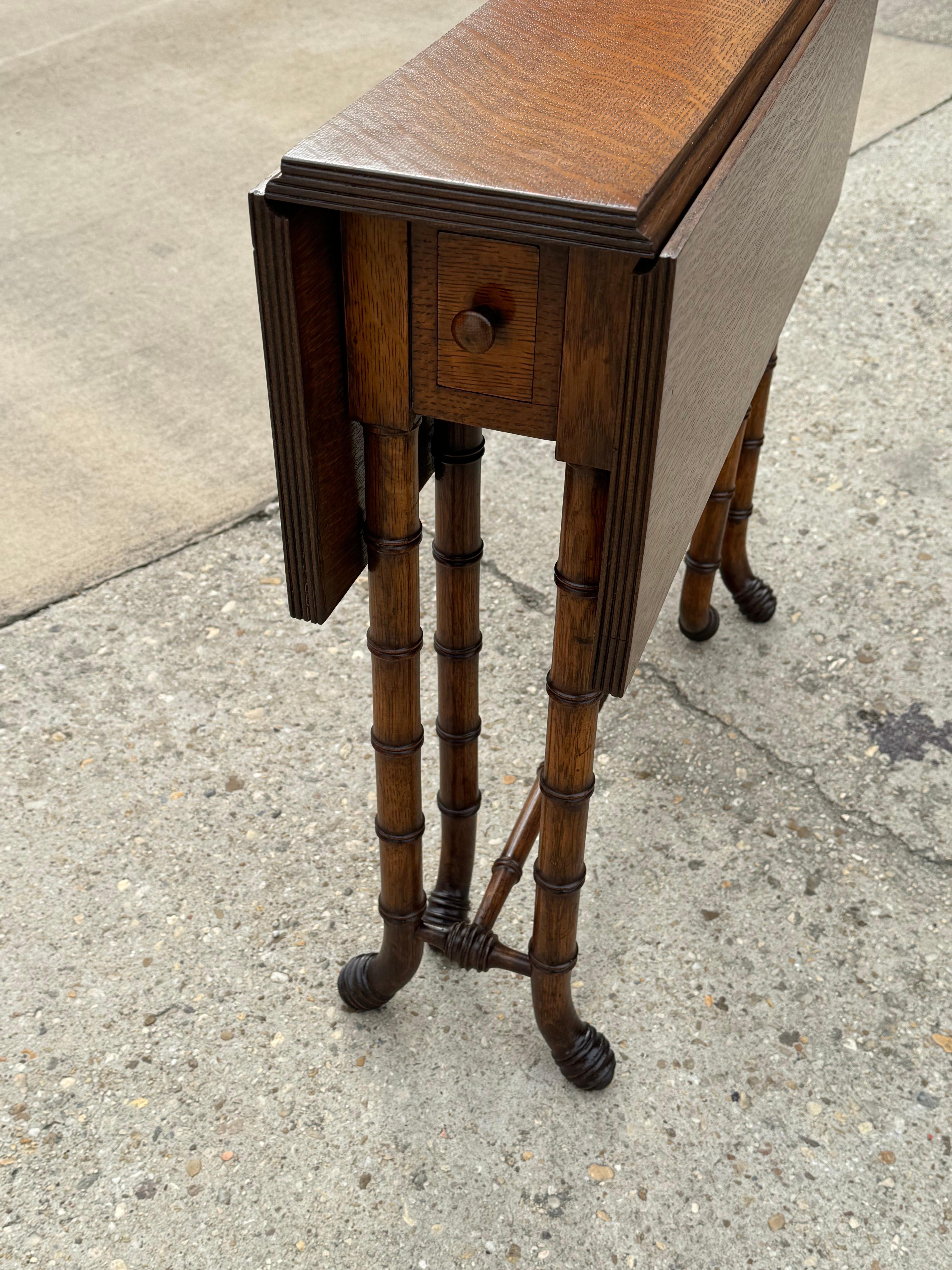 British Colonial Newly Refinished Antique Drop-leaf Tiger Oak table with Faux Bamboo Legs For Sale