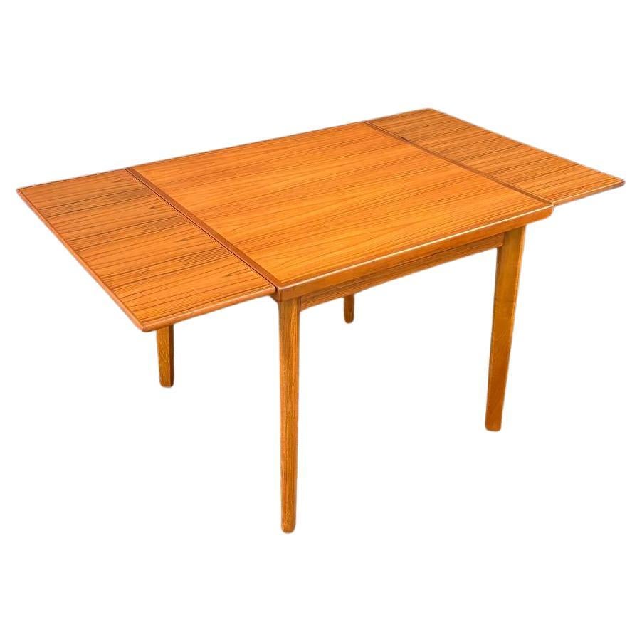 Newly Refinished - Danish Modern Teak Expanding Draw-Leaf Dining Table For Sale
