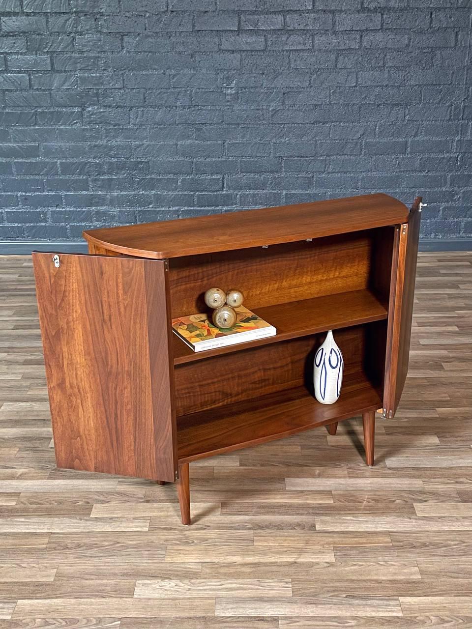 Newly Refinished - Mid-Century Modern Sculpted Walnut Bow-Front Cabinet In Excellent Condition For Sale In Los Angeles, CA