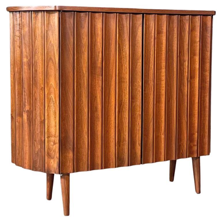 Newly Refinished - Mid-Century Modern Sculpted Walnut Bow-Front Cabinet For Sale