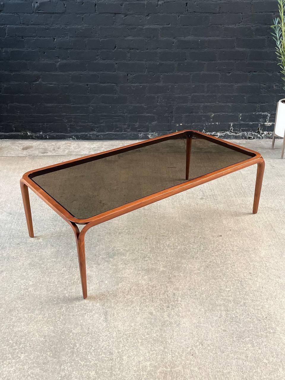 Newly Refinished, Original Smoke Glass Top

With over 15 years of experience, our workshop has followed a careful process of restoration, showcasing our passion and creativity for vintage designs that can seamlessly be incorporated with many