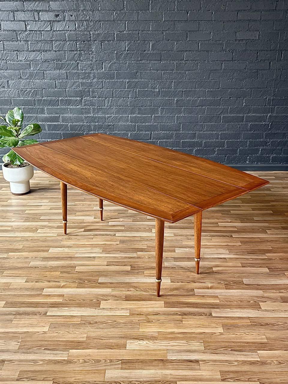 Condition: Expertly Refinished 
Designer: Tomlinson
Manufacturer: Tomlinson
Materials: Walnut-Stained Mahogany Wood, Patinated Brass Accents 

With over 15 years of experience, our workshop has followed a careful process of restoration, showcasing