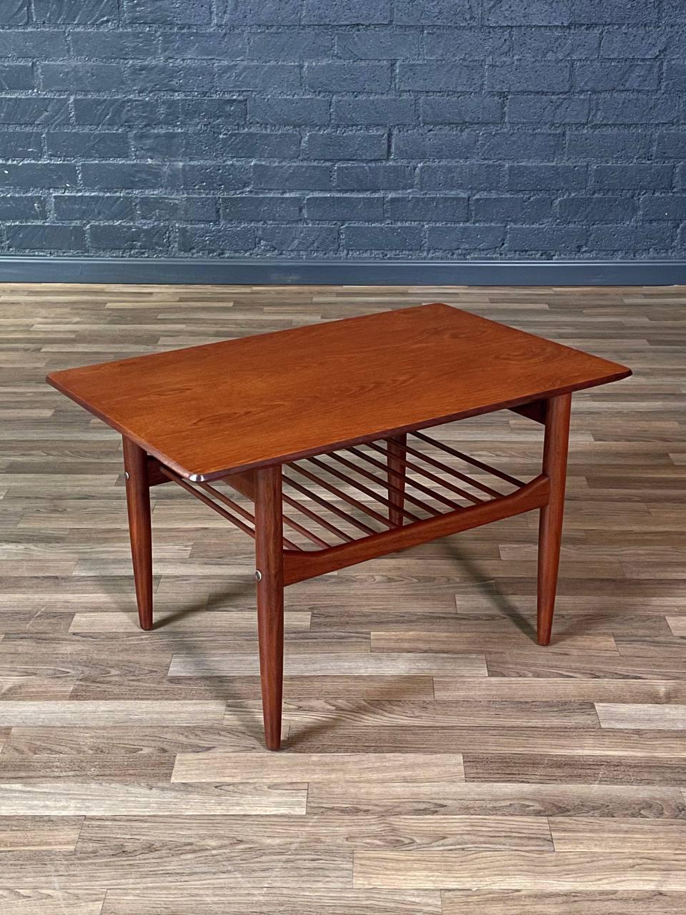 Condition: Original Vintage Condition

This expertly refinished mid-century side table was designed by Danish architect-designer Ib Kofod-Larsen for the English maker G-Plan in the 1960s. The rectangular top appears to float over tapered legs and a