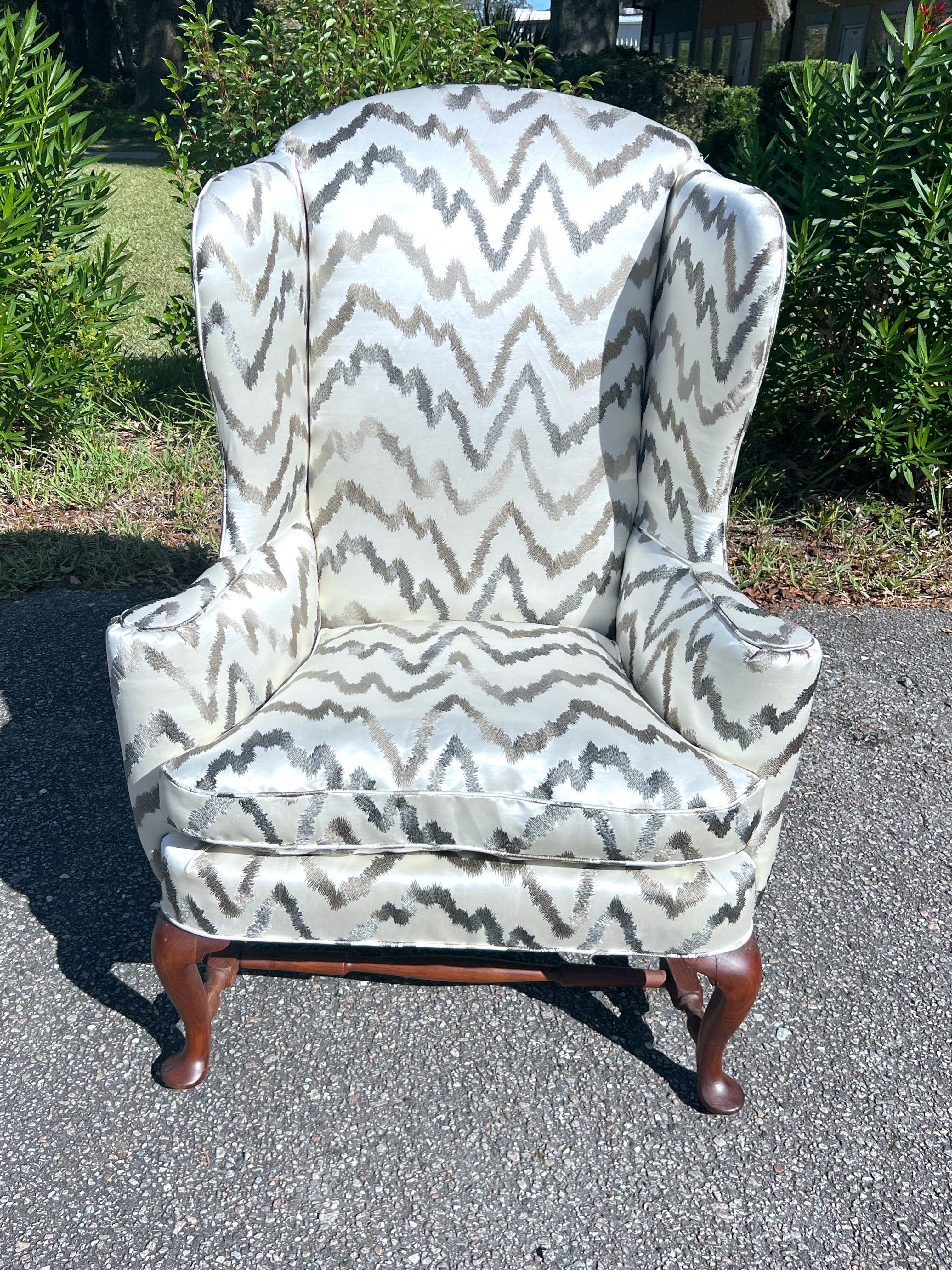 Made from Mahogany frame with carved cabriole legs in front and square splayed legs at back. Lets are connected by a turned H-stretcher, newly upholstered in Donghia Fabric.  

DONGHIA EMBROIDERED ZIG ZAG SILK SATIN FABRIC RODEO SILVER COLORWAY: