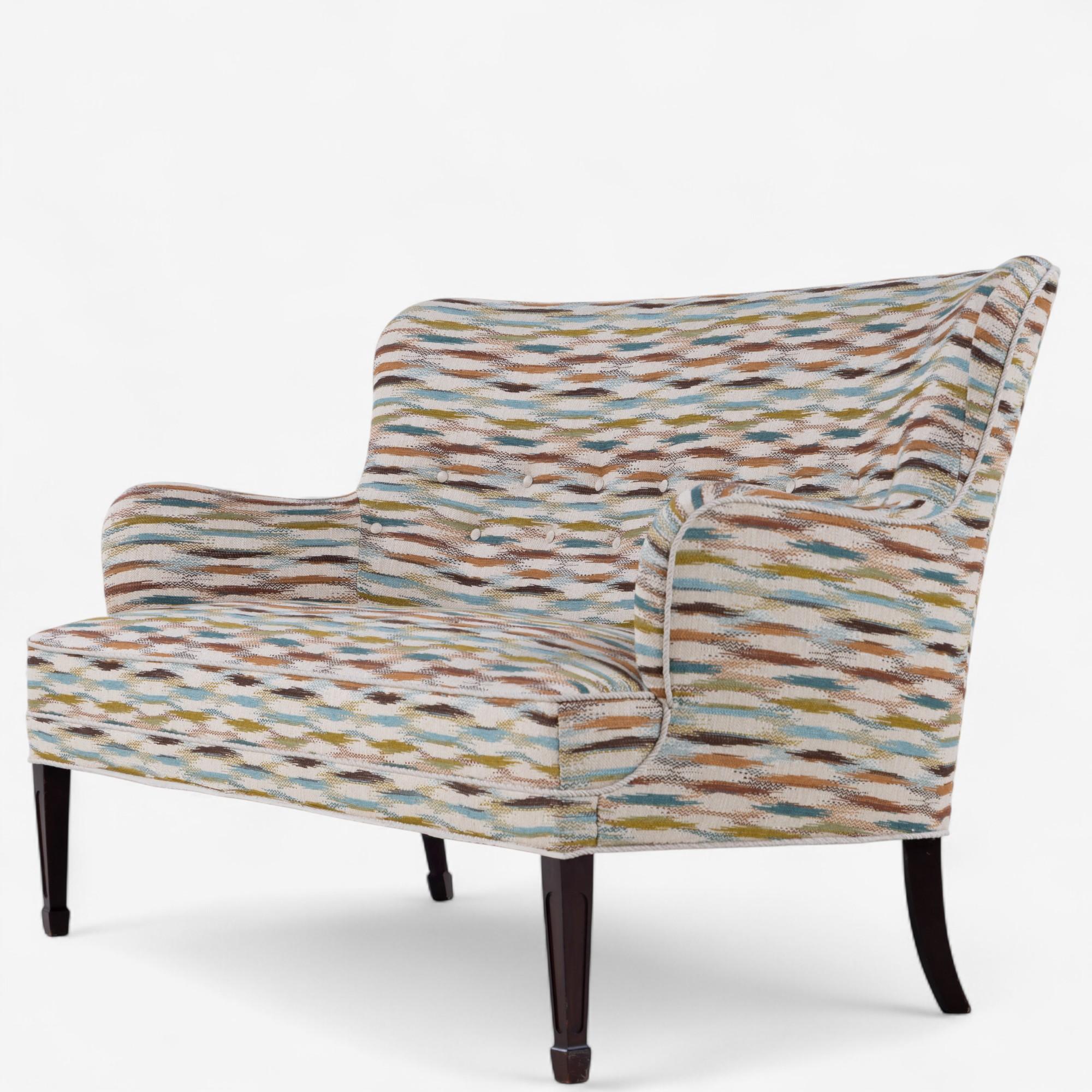 Newly upholstered 2-seater sofa in 'Felbrigg' fabric (Teal/Chestnut) with dark stained mahogany legs. Designed in the 1940s by Frits Henningsen.