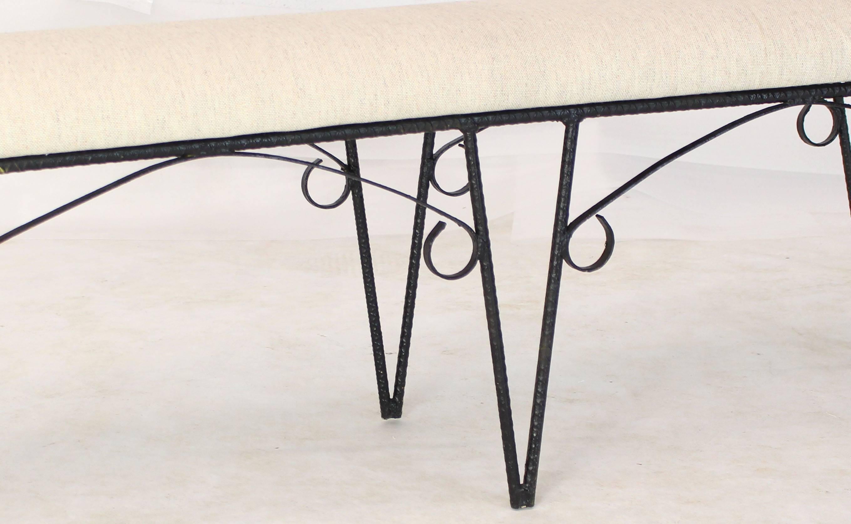 Decorative welded rebar with scrolls Mid-Century Modern bench from, circa 1970s, with new heavy solid linen upholstery.