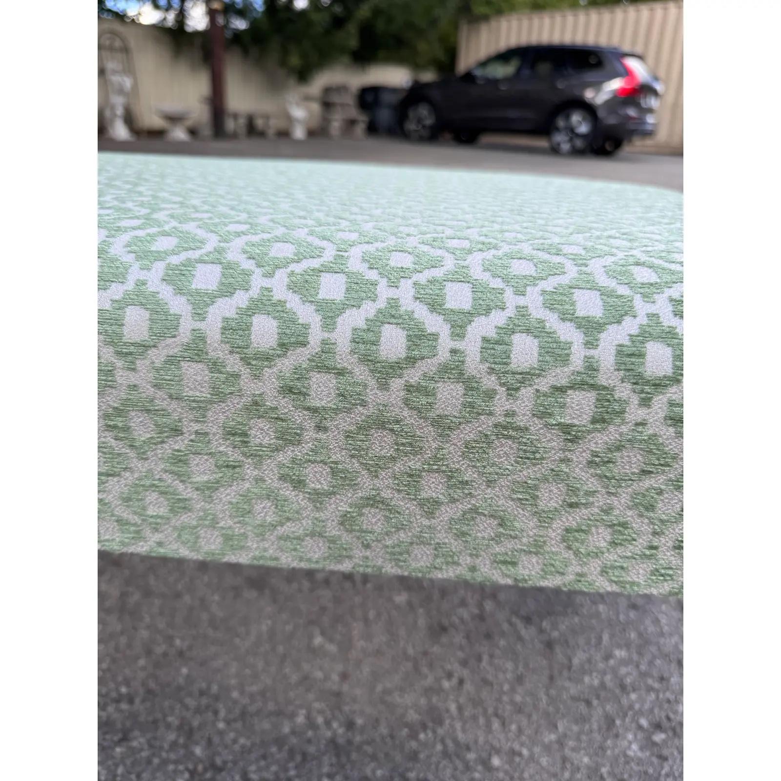 This is a beautiful antique English bench! Newly reupholstered, this bench is in stunning condition. The legs are sturdy and firm, with a lovely patina and hand carved detailing as well as turned design. The new fabric is a green patterned fabric