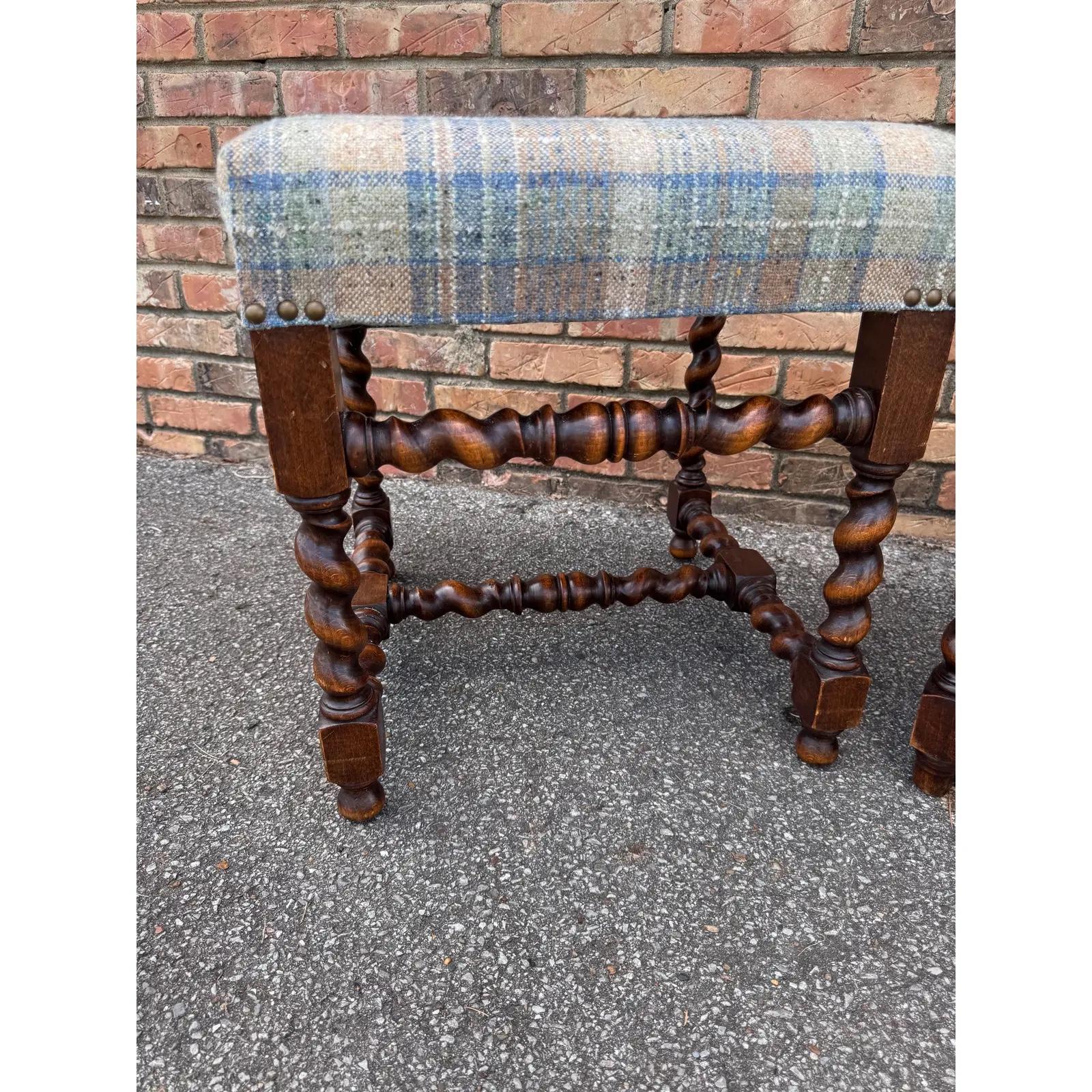 This is such a beautiful pair of plaid stools! The frame is an original French antique, with beautiful turned legs with stretcher bar. The fabric is a blue railroad plaid fabric design that can add depth without being overpowering. See