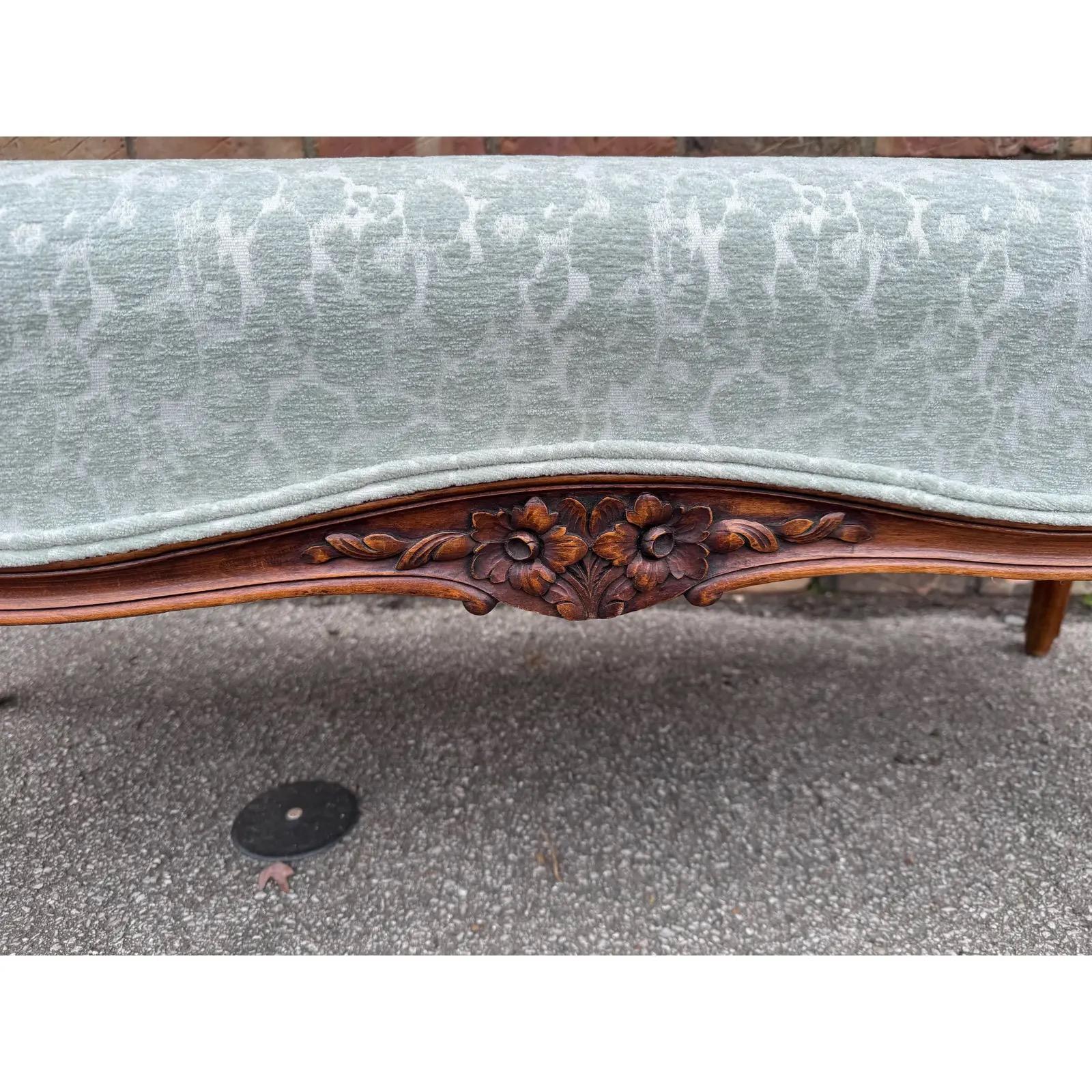 This is a beautiful French frame that we have had recently upholstered. The frame has gorgeous hand carved detail on the center and legs. The flower and leaves have such intricate texture! The fabric is a soft grey/blue leopard print velvet. This