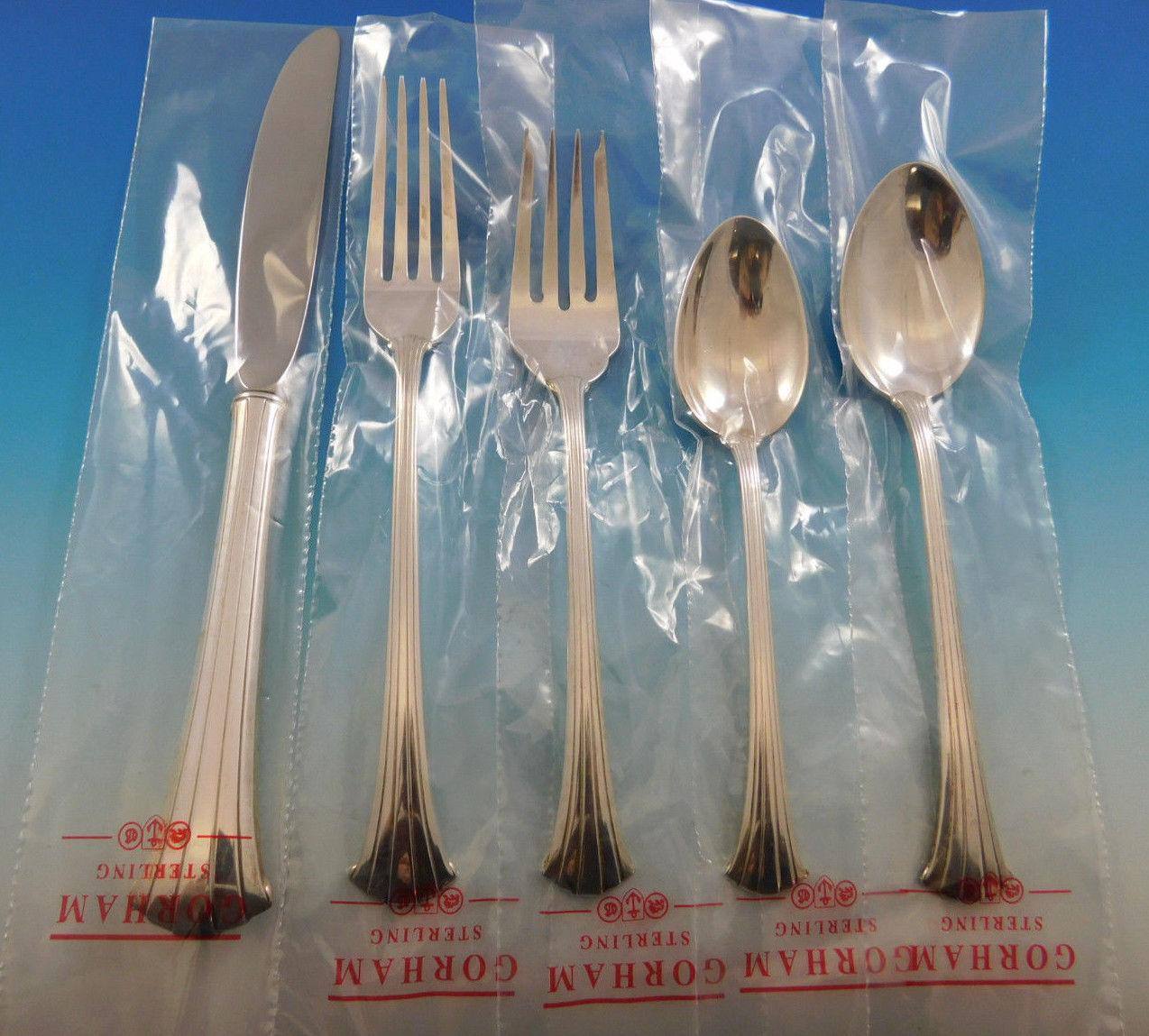 Gorgeous unused Newport Scroll by Gorham sterling silver flatware set of 64 pieces. This set includes:

12 place knives, 9 1/8