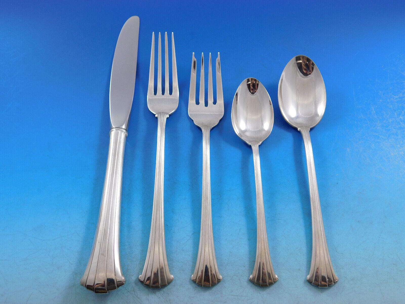 Gracefully curved lines distinguish Newport Scroll. The gently flared ends of each handle add a unique and interesting element to any table setting.
Newport Scroll by Gorham sterling silver Flatware set, 69 pieces. This set includes:

12 Place
