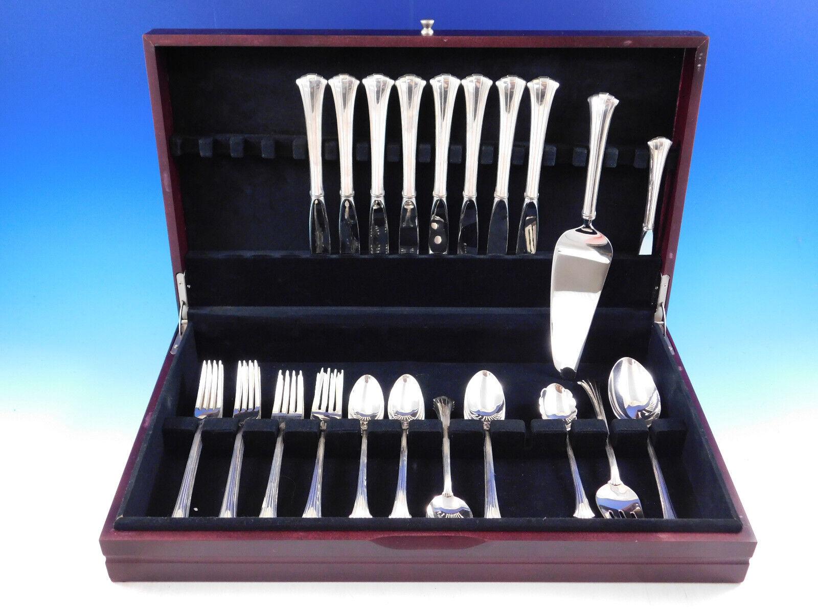 Gracefully curved lines distinguish Newport Scroll. The gently flared ends of each handle add a unique and interesting element to any table setting.
Newport Scroll by Gorham sterling silver Flatware set, 45 pieces. This set includes:
8 Place Size