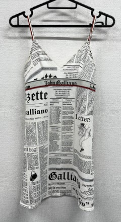 Newspaper/gazette/newspaper print slip dress, an iconic John Galliano design.